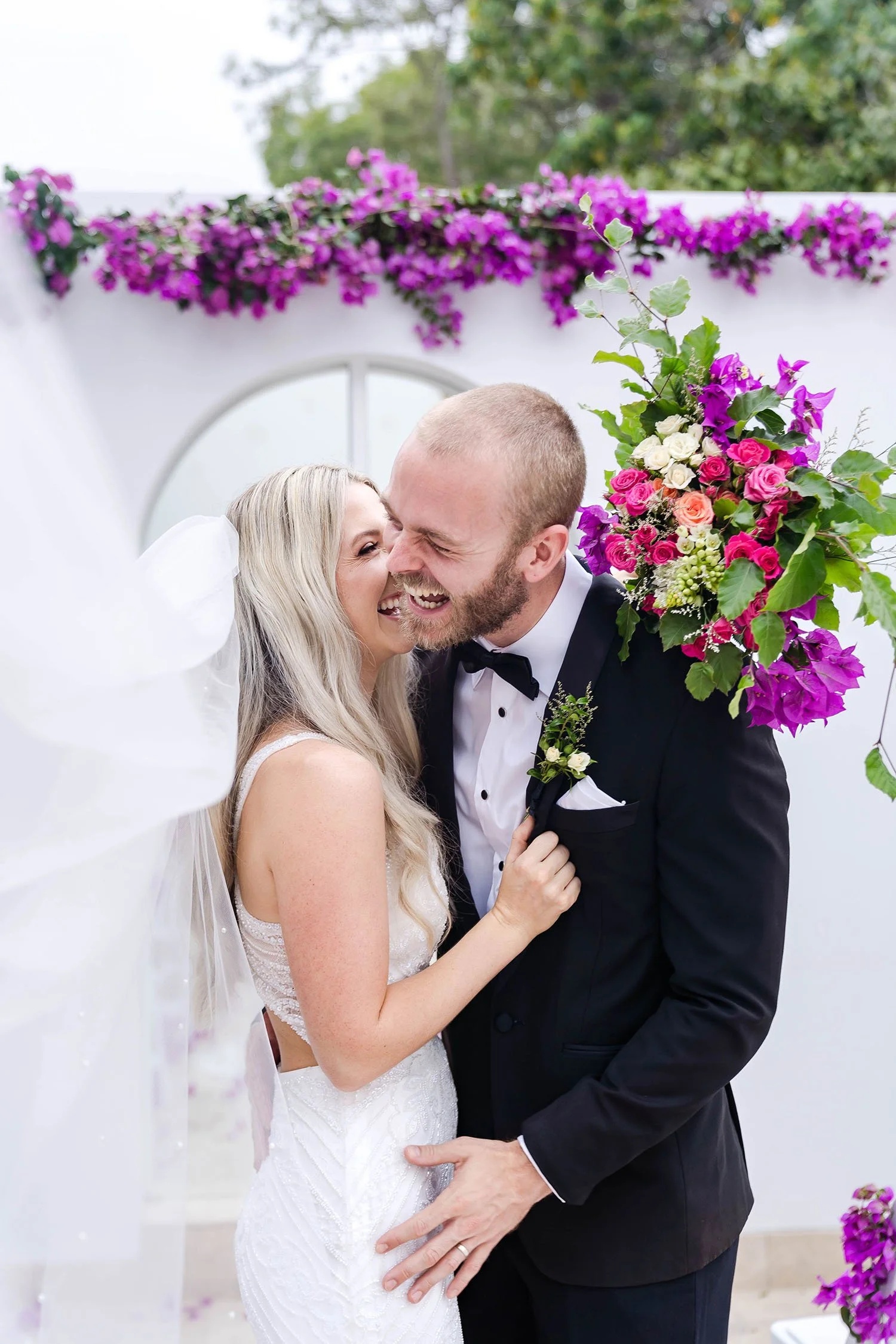 relaxed fun wedding photo of bride and groom laughing