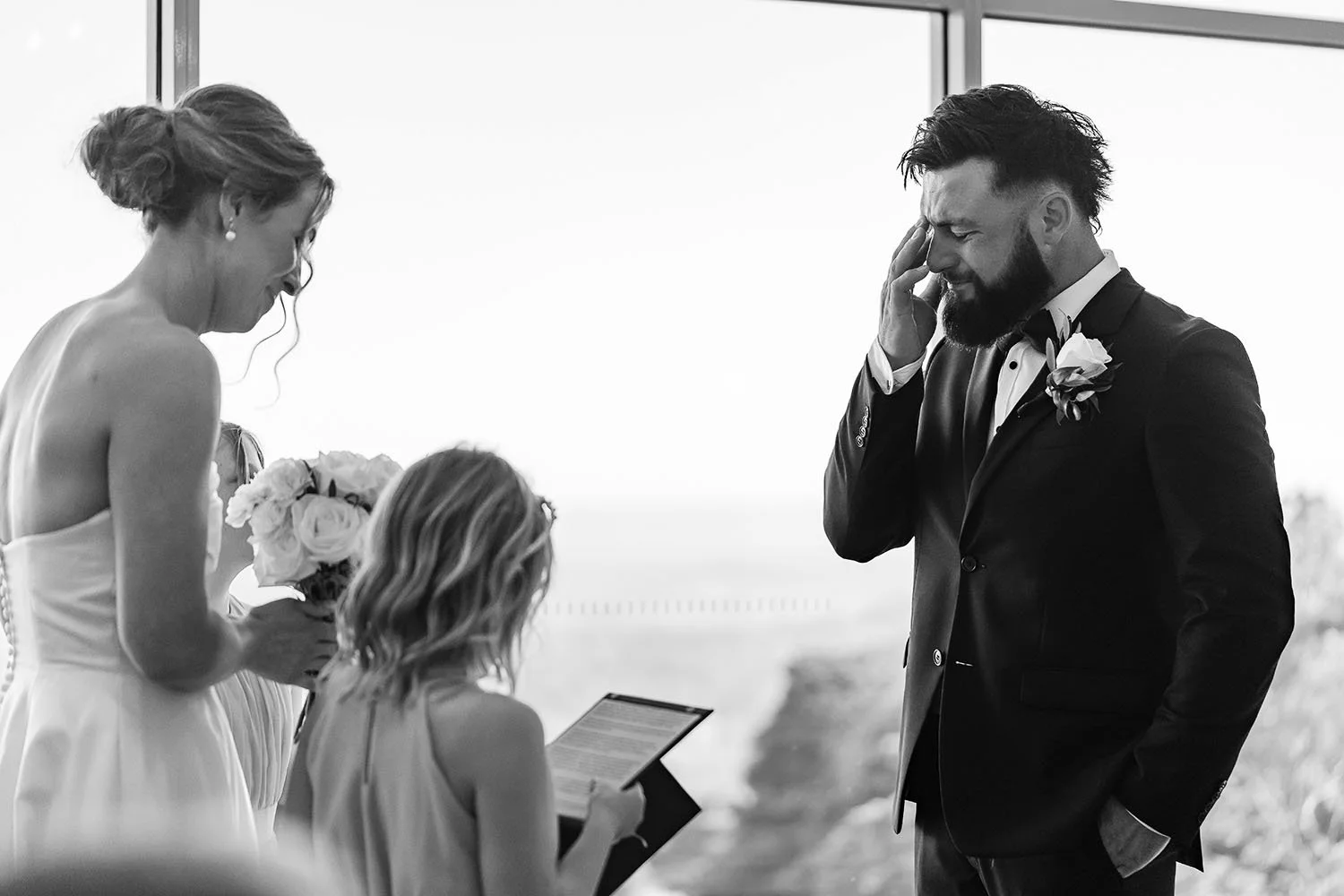 candid wedding photography moment of a groom during the ceremony