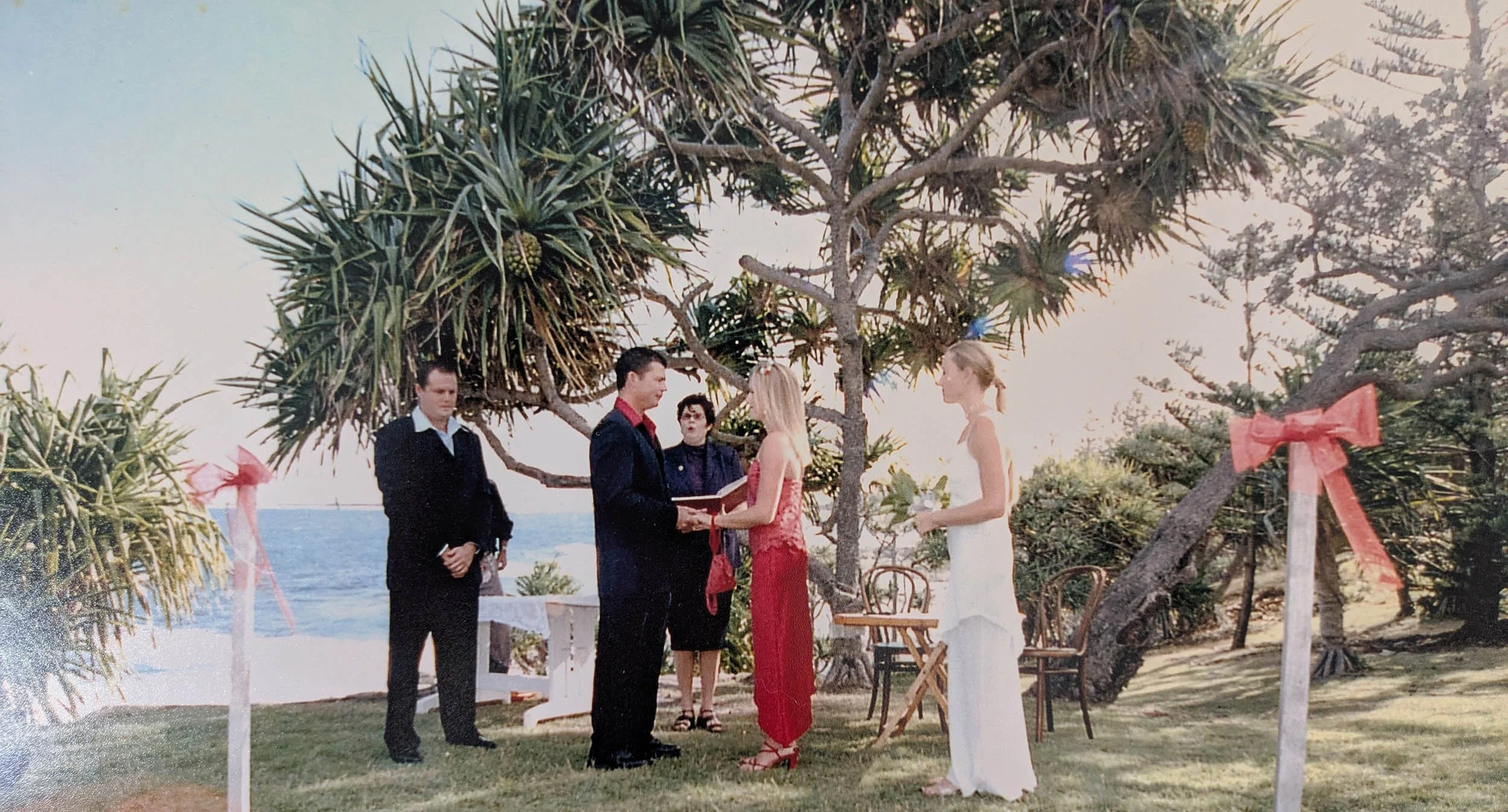 red wedding dress at Caloundra Headland wedding