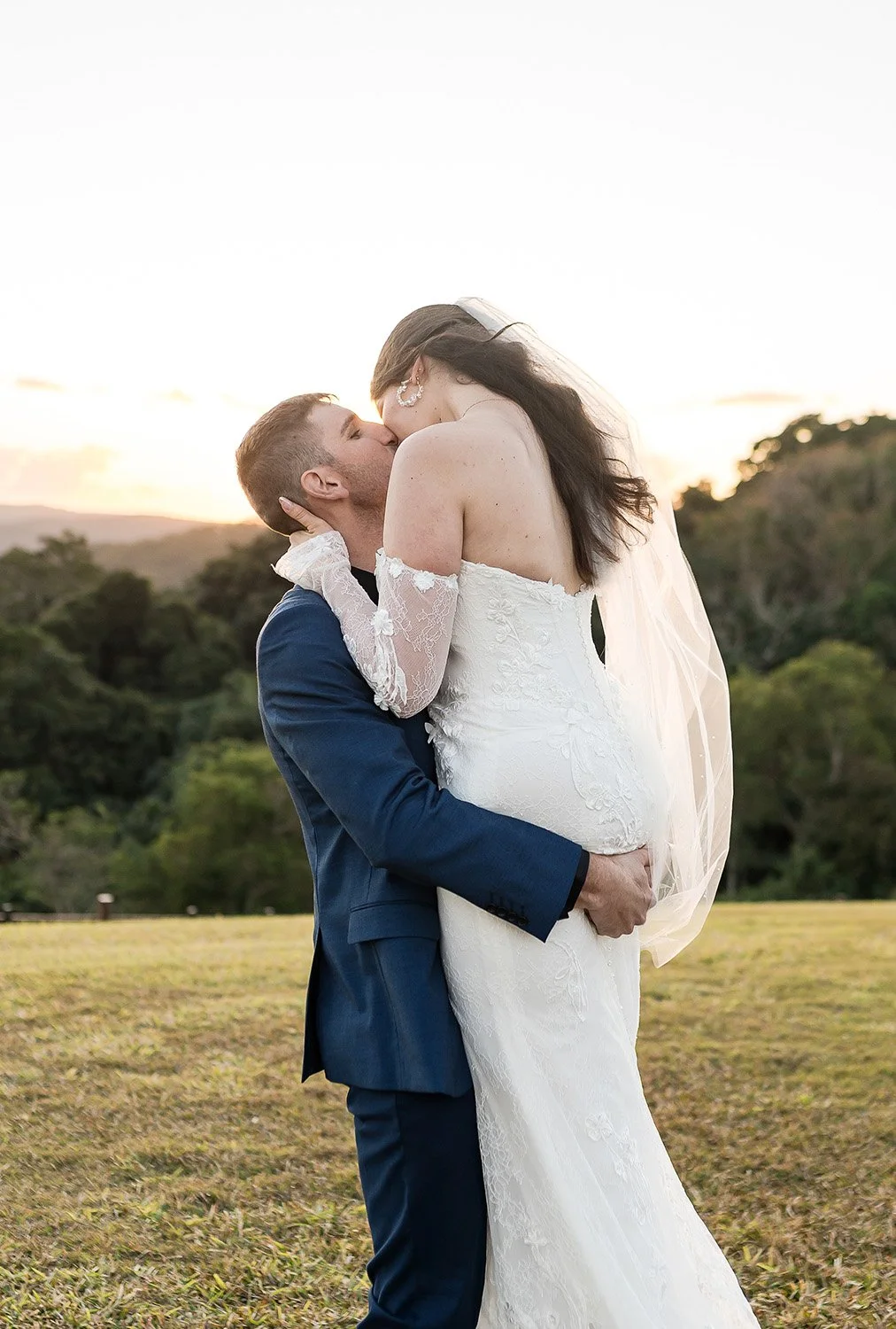 lift kiss with bride and groom at montville wedding venue
