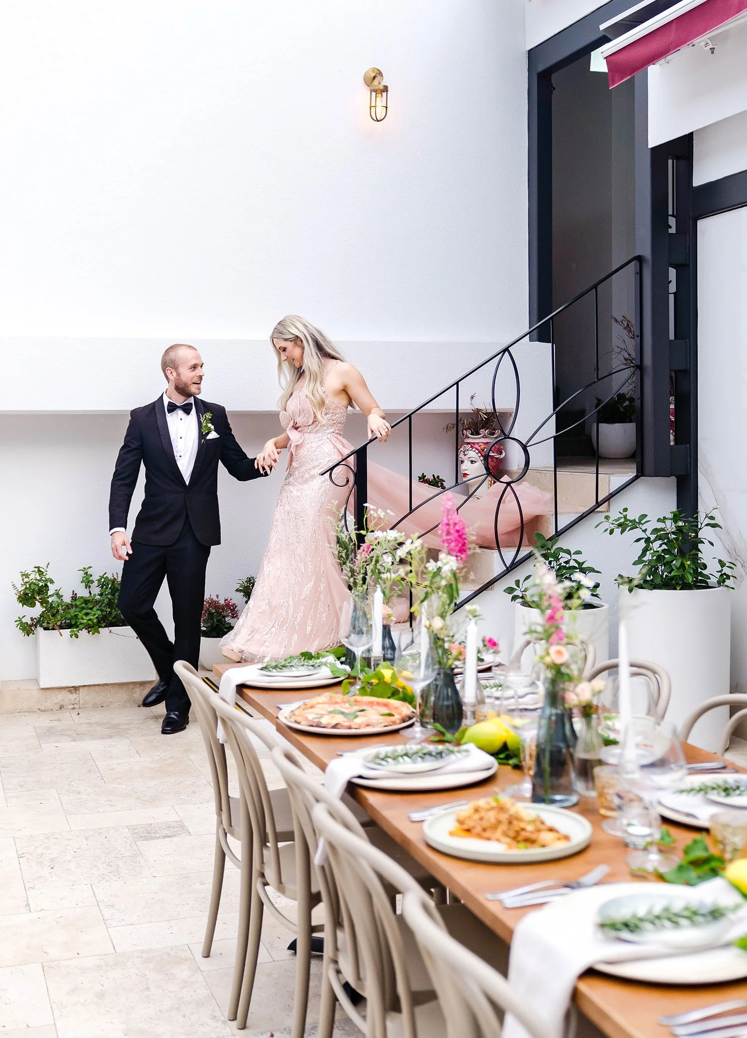 bride and groom enter their intimate wedding reception