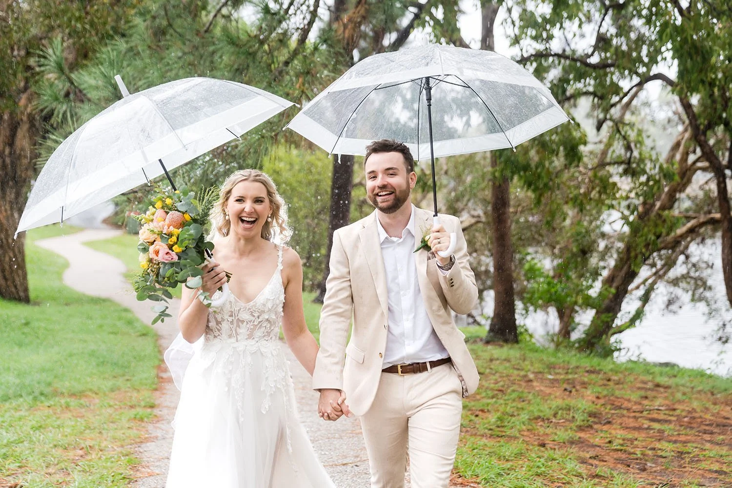 rainy day wedding photos with umbrellas
