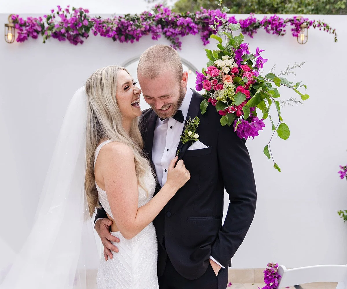 bride and groom share a laugh at their destination wedding reception