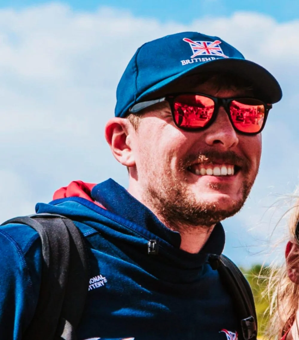 Tom at a regatta in rowing team kit