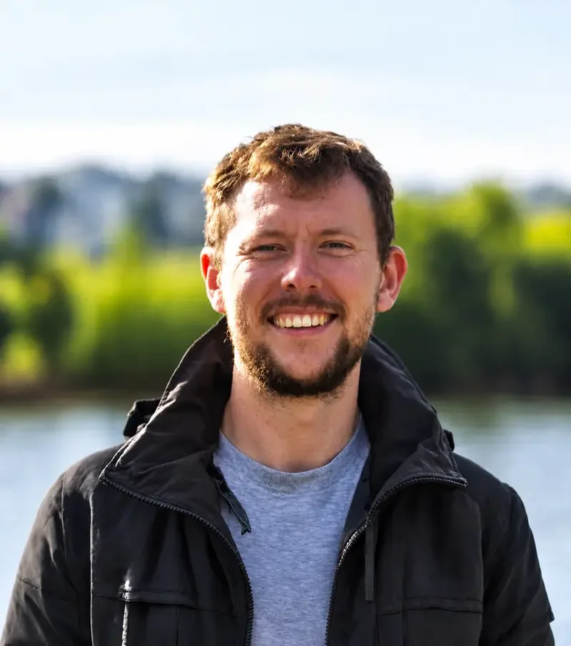 Tom Selby smiling by the river