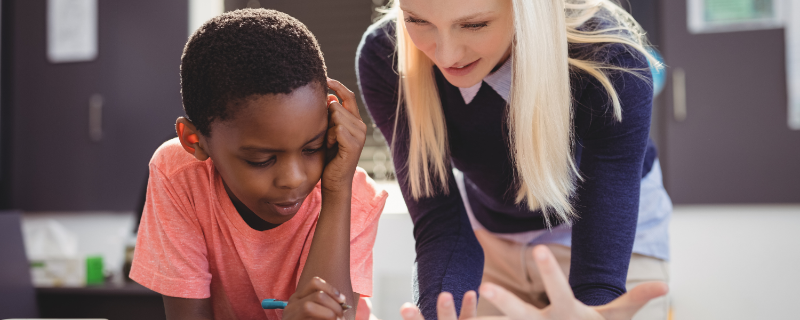 A math teacher working with a student.