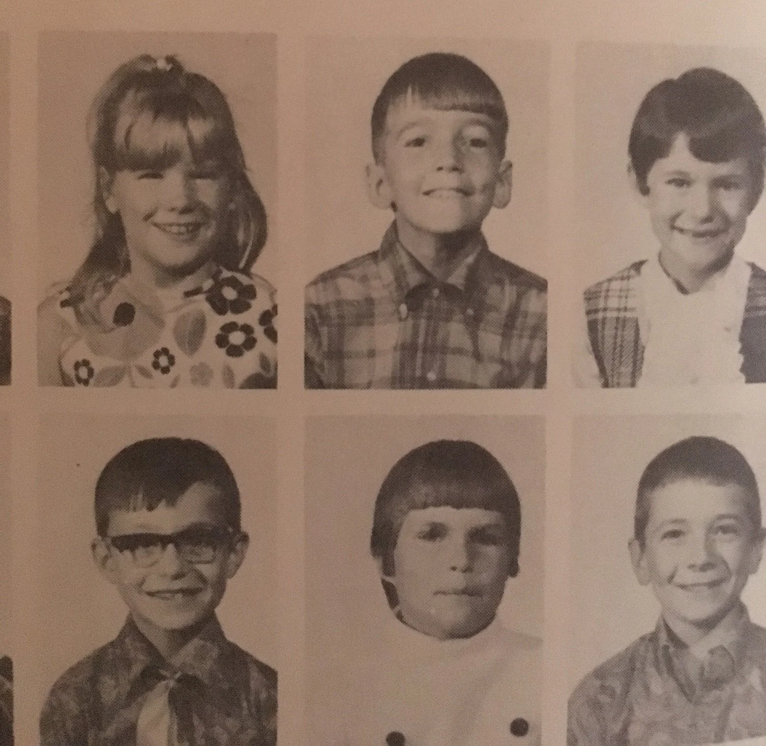 Black and white photo of grade school class picture showing six third-graders from 1969third