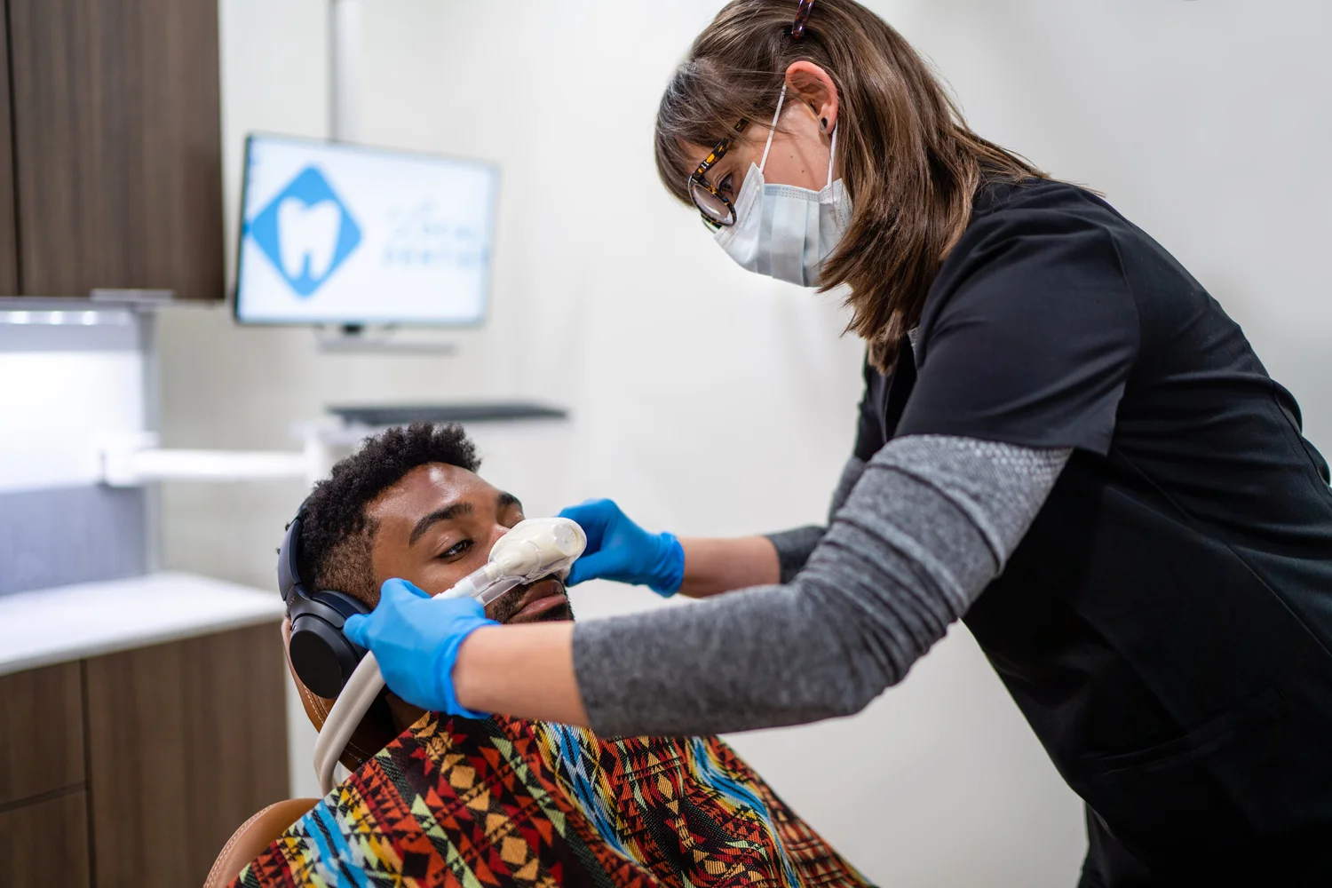 Local Dentist team member in the office with a patient