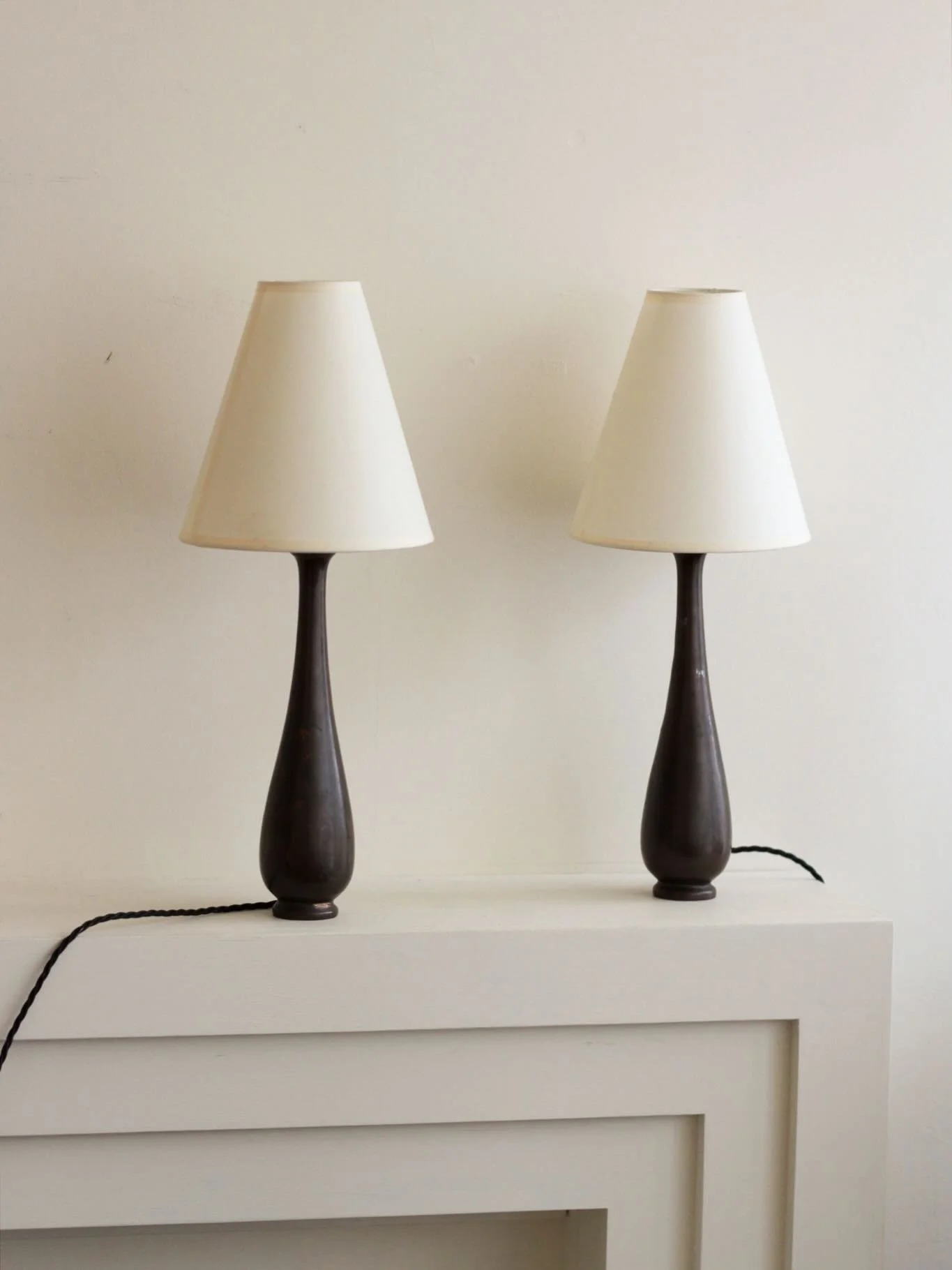 A pair of baluster lamps in bronze with decorative inlay including bamboo, florals, foliage and calligraphed characters.

Newly rewired with black twisted flex, UK plug and fully PAT tested. Supplied with conical shades as pictured.

Height with shad