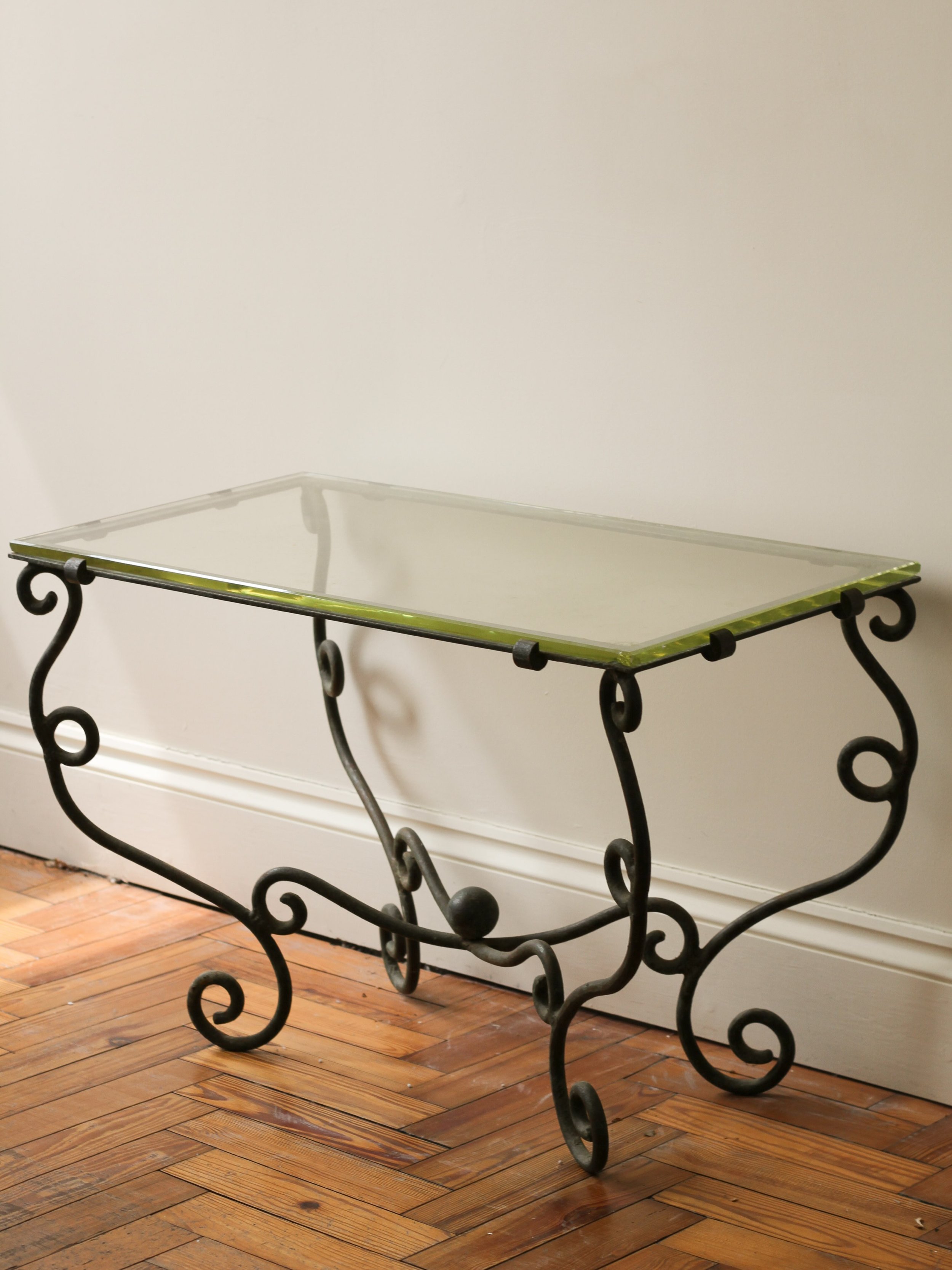 Now sold; A scrolled verdigris ironwork coffee table with Saint Gobain glass top.

C1950, France.

Height: 52cm
Length: 80cm
Width: 42cm