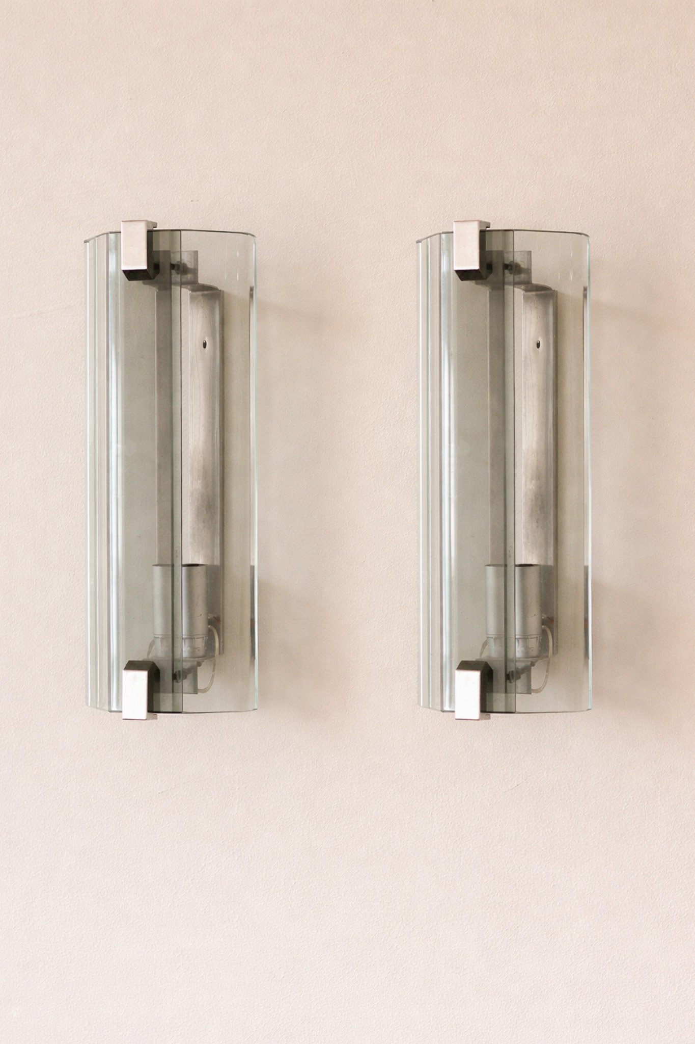 Modern wall sconces on neutral wall.jpg
