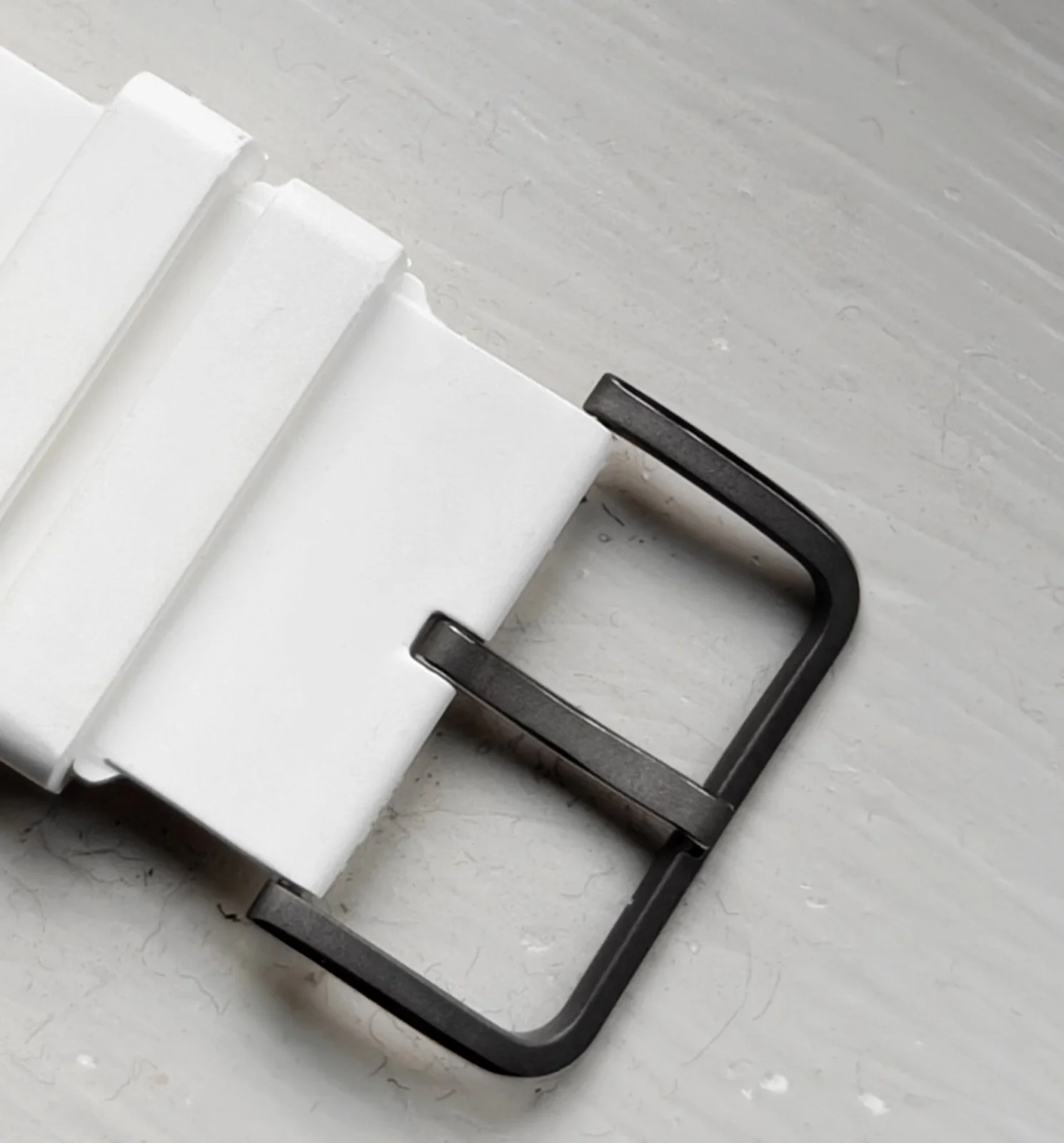 Behrens titanium pin buckle on white rubber strap