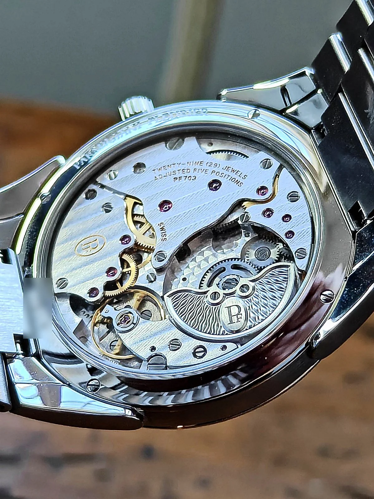 Parmigiani PF703 movement with platinum micro-rotor through exhibition caseback