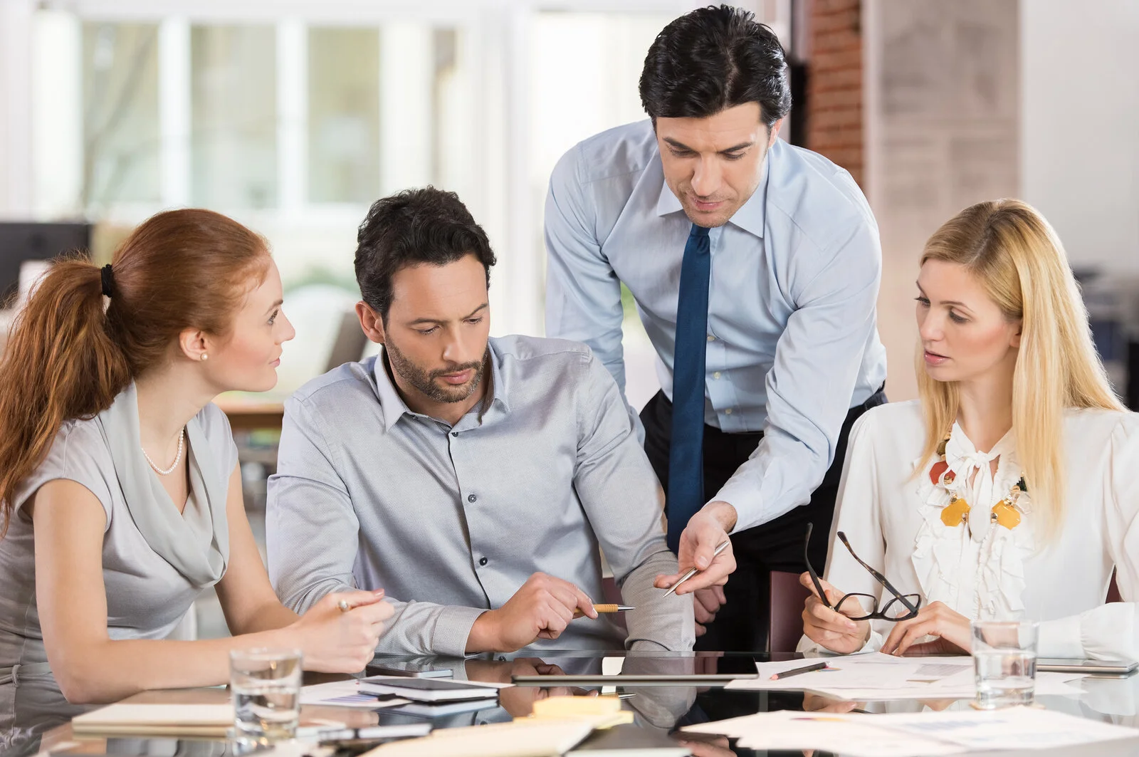 bigstock-Team-leader-pointing-charts-an-126827279-1-1 (1).jpg