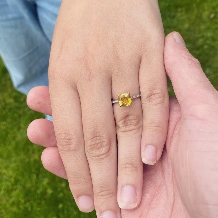 Congratulations to the beautiful couple Ewan &amp; Emma on their engagement!

We just had to share this, Emma is wearing a stunning 2.5ct yellow sapphire cushion cut - specifically selected and set in a 18ct yellow gold head with platinum and diamond