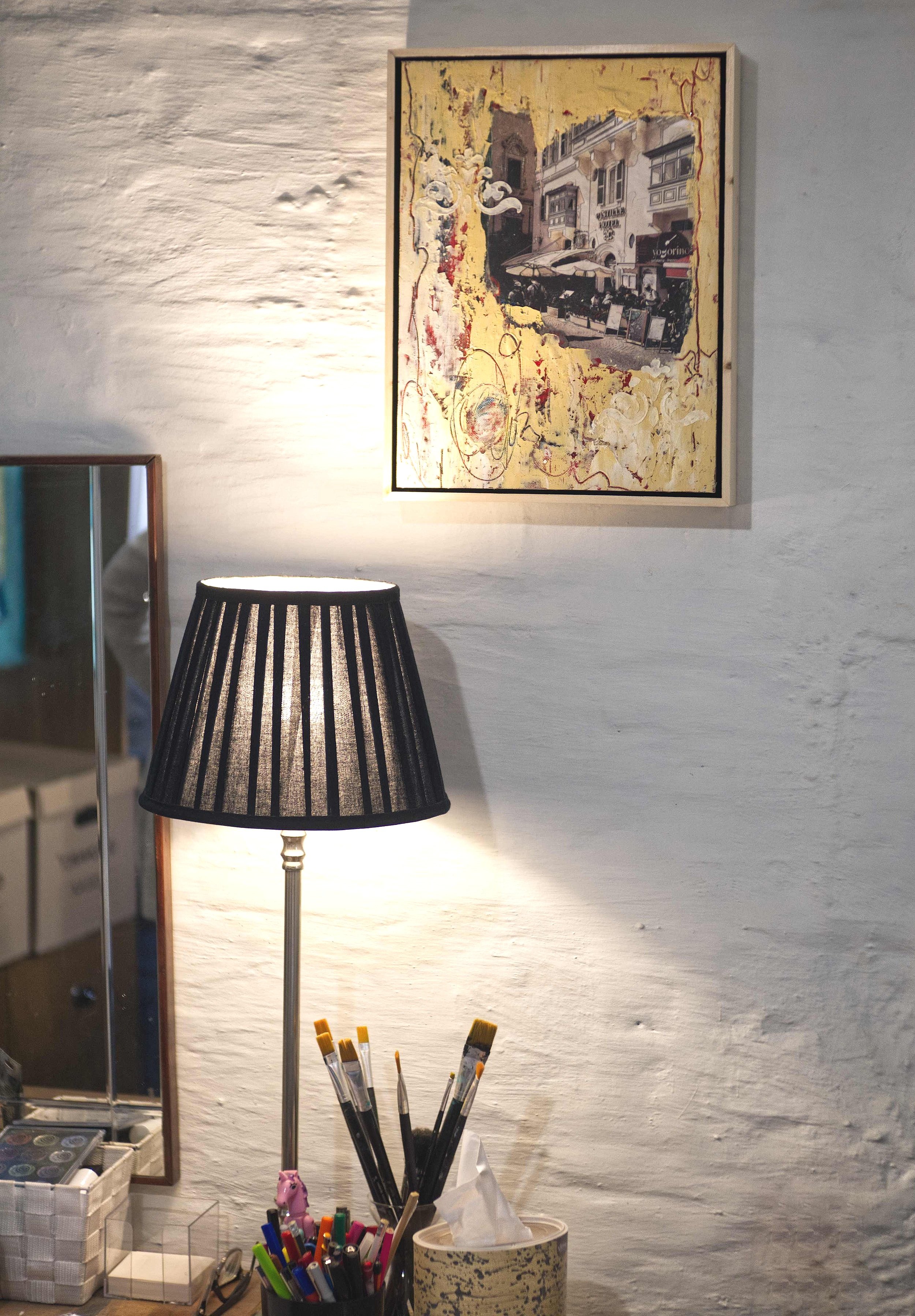 Yellow Cafe on the wall in the artist's studio.