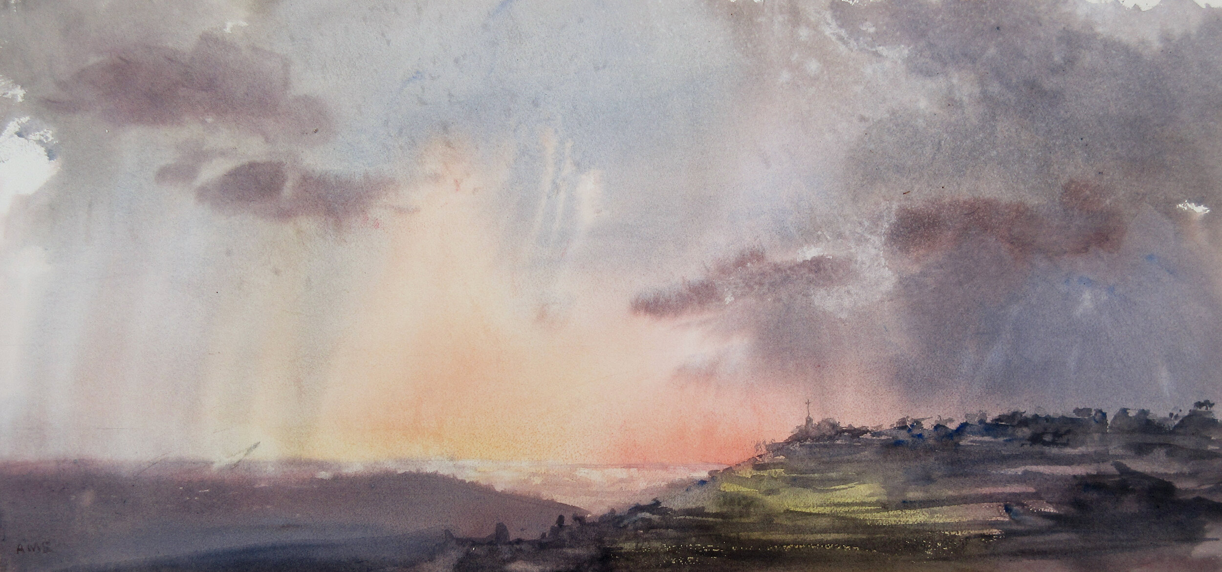 Colourful landscape showing rolling hills and a distant cross, sky taking up most of the frame.