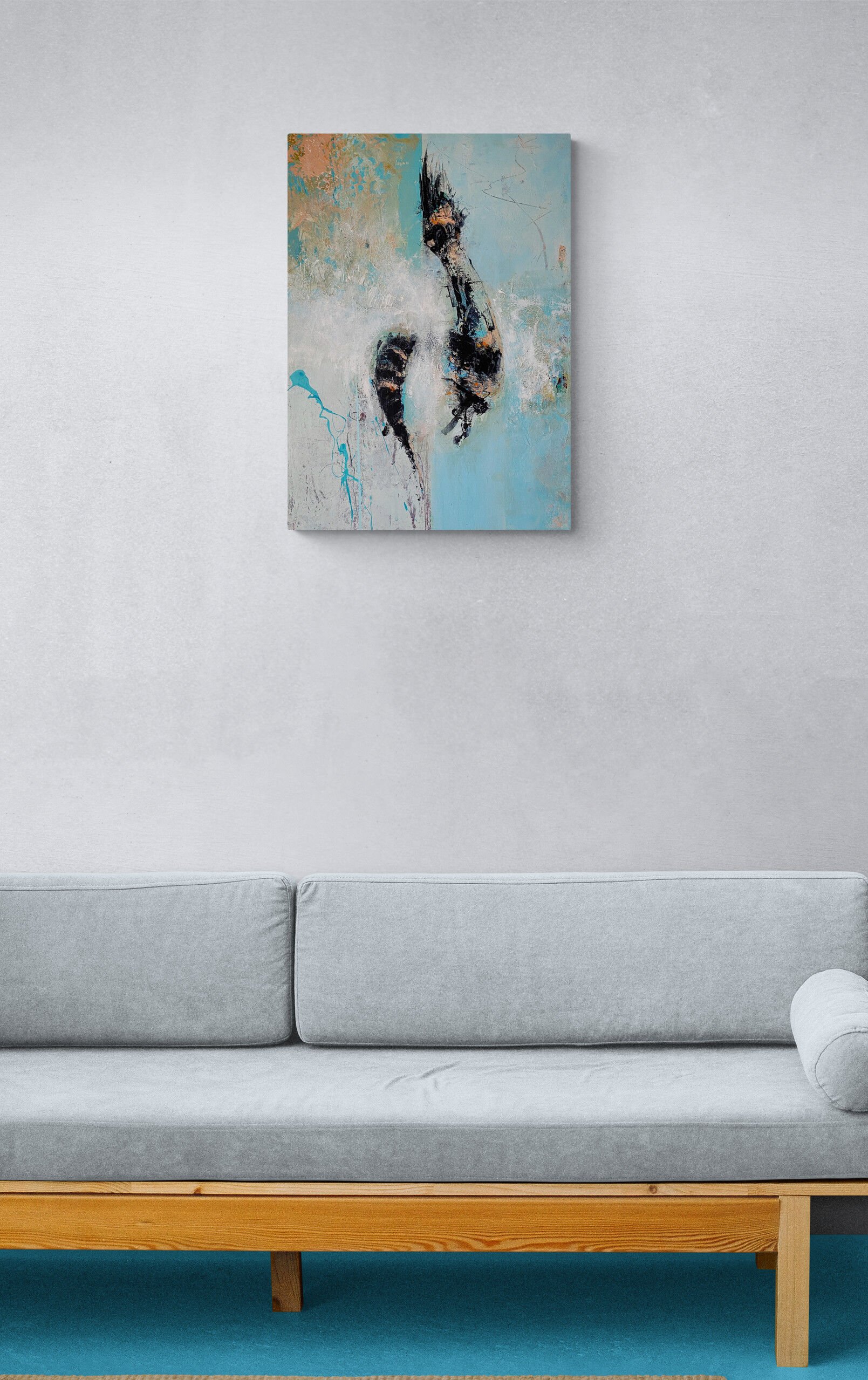 Untitled 215 painting on the wall with grey sofa in foreground.