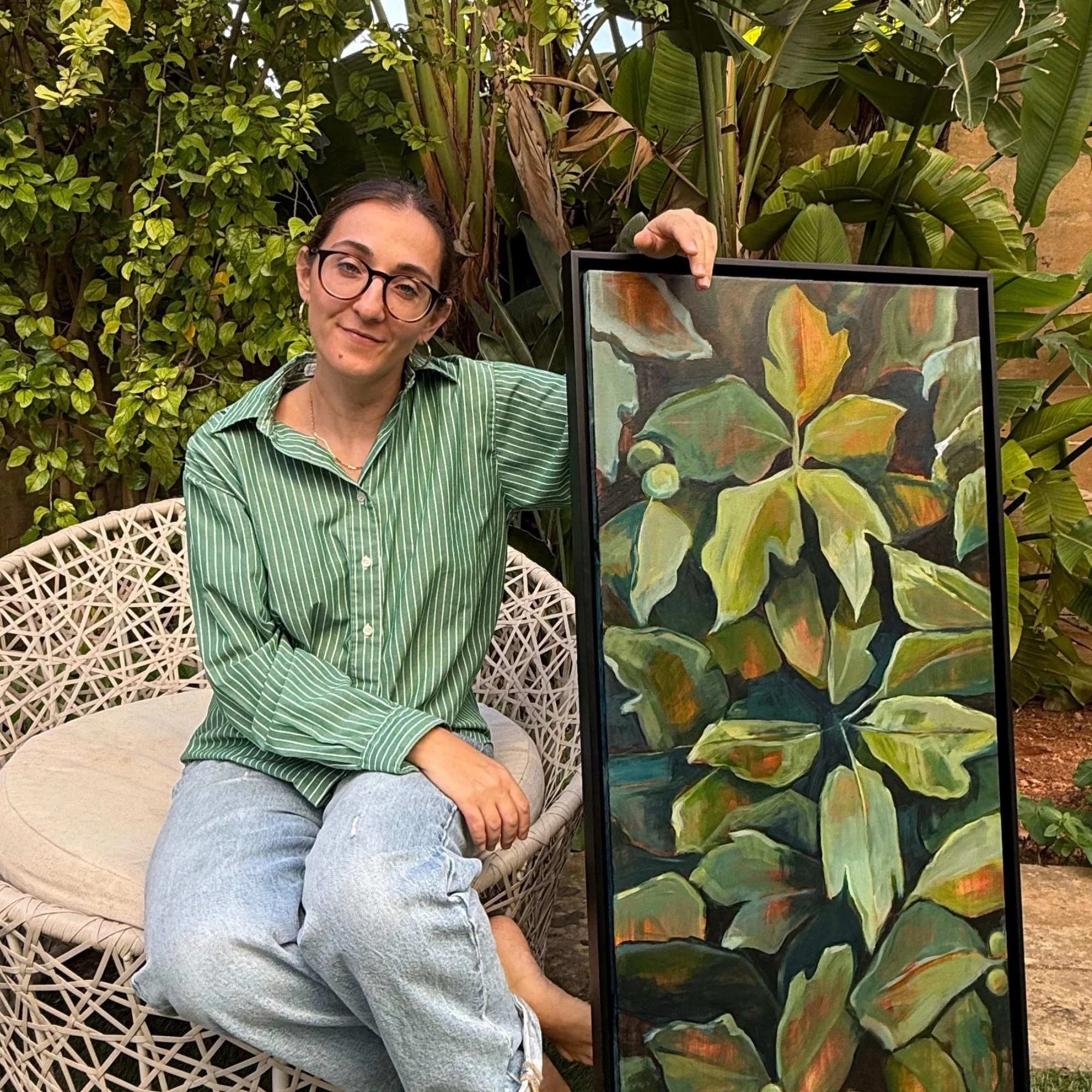 Emerging artist Lisa Cassar with her painting Breathe Easy