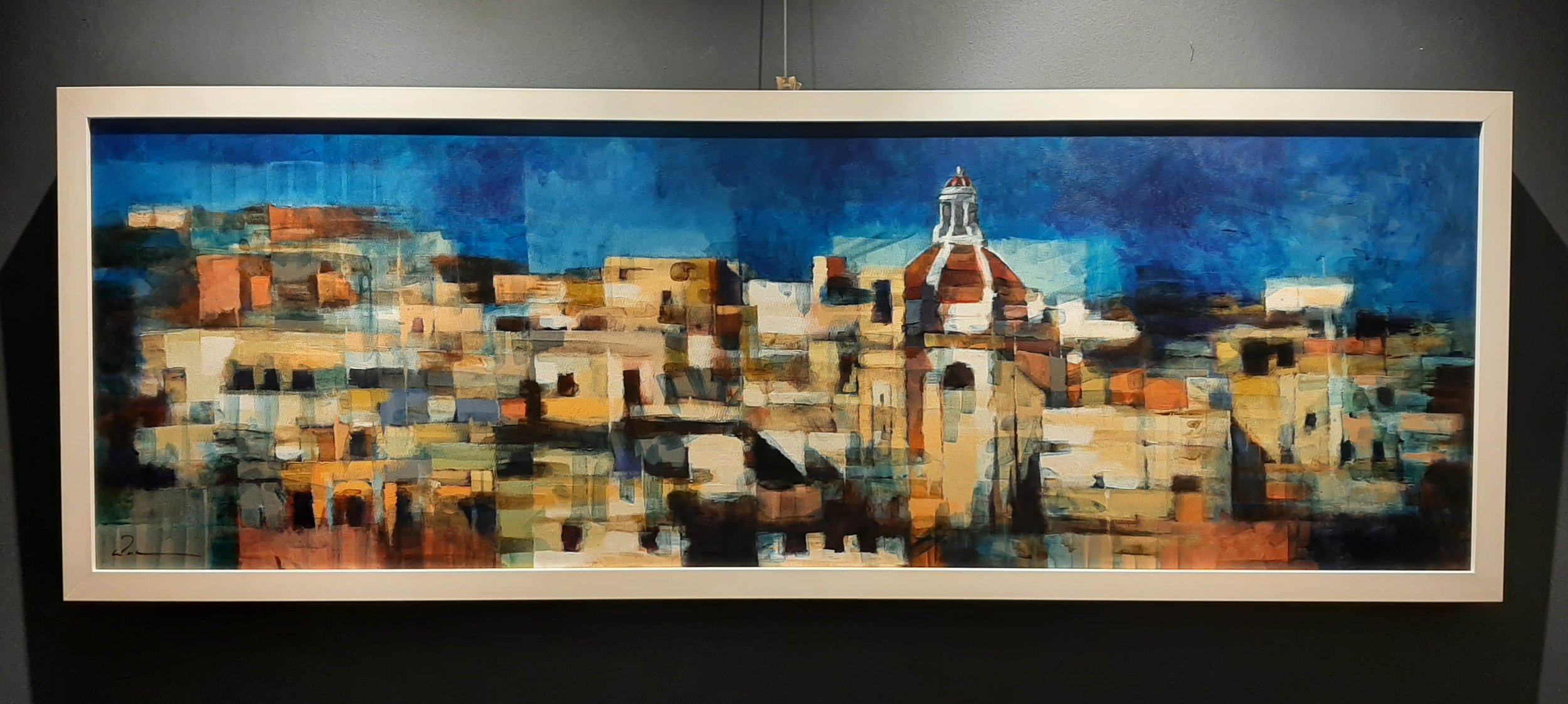Kevin Sciberras' painting Cospicua Skyline framed on the wall