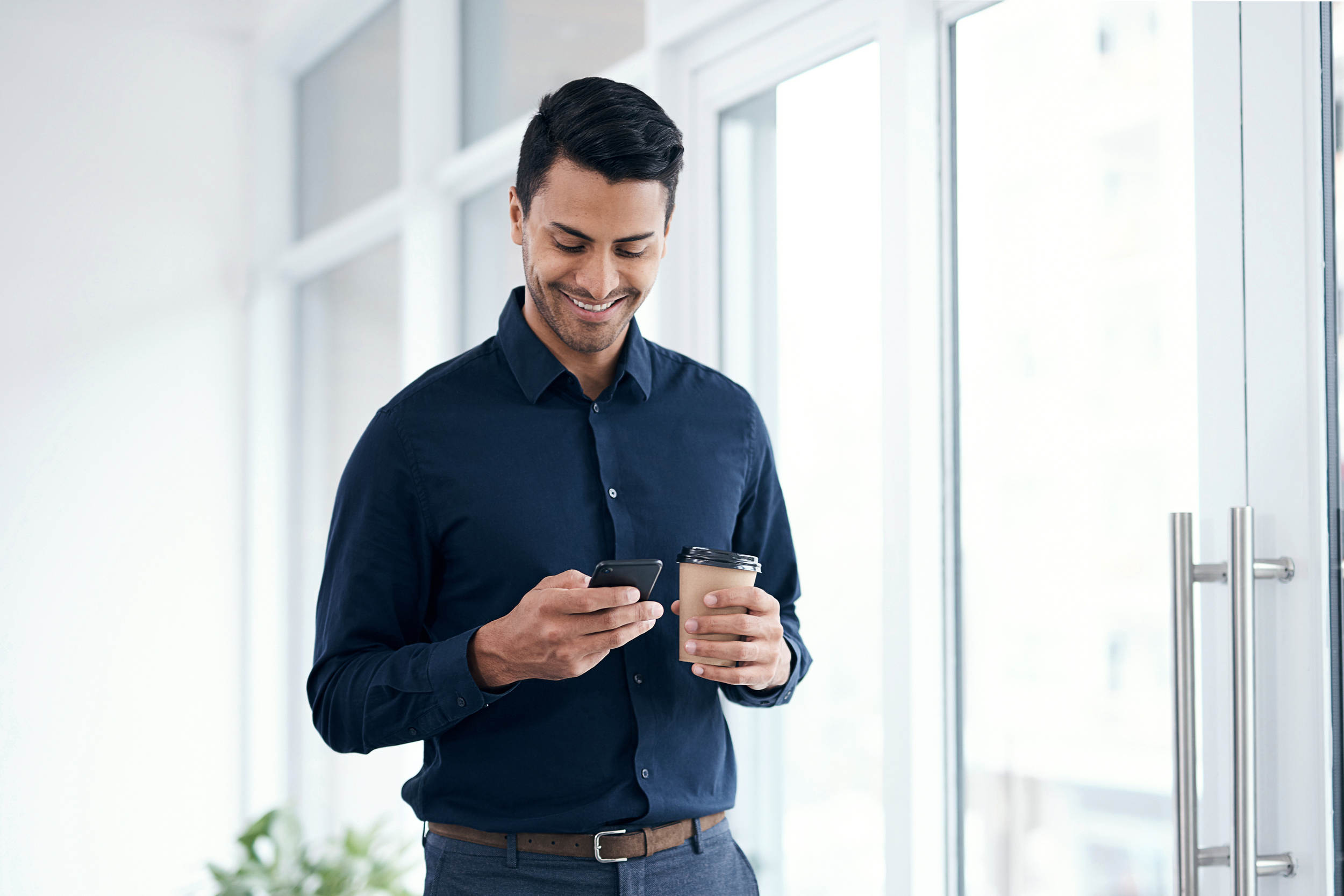 chicago personal assistant holding coffee and phone