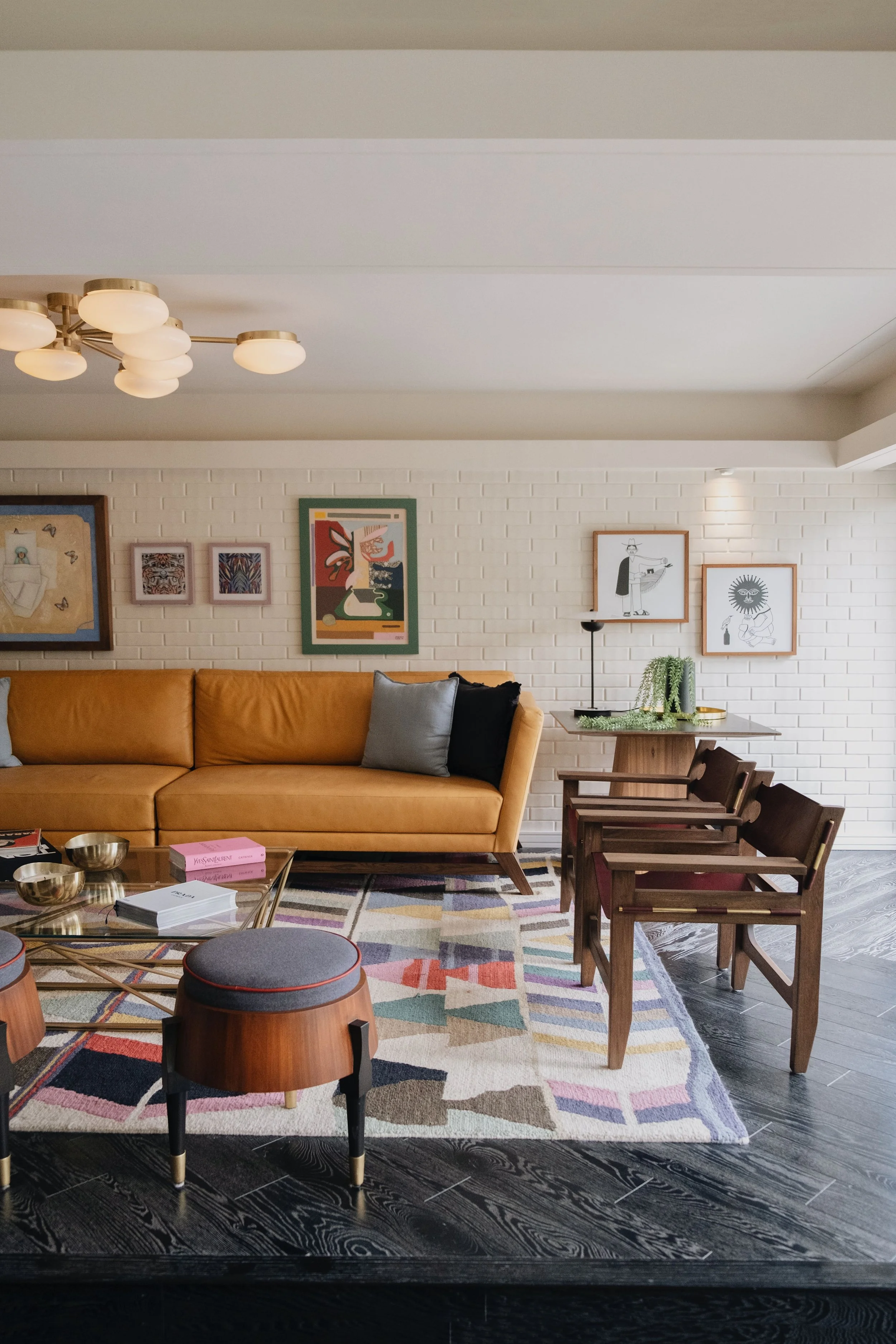 Seating area with leather couch and chairs. 