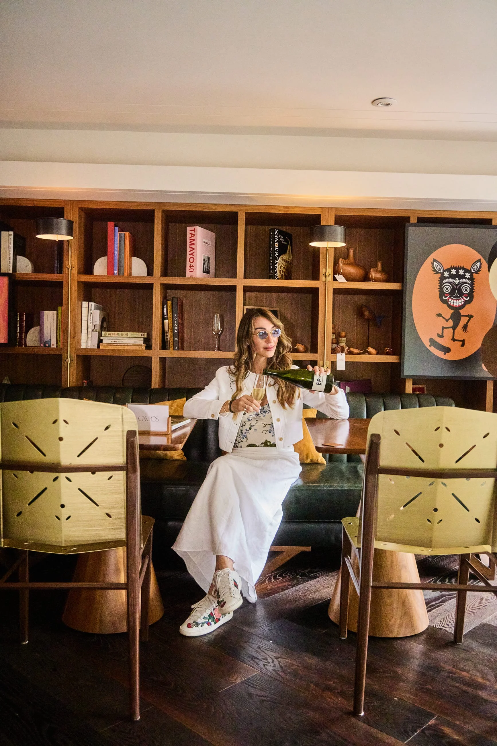 Woman sitting in lobby hotel area