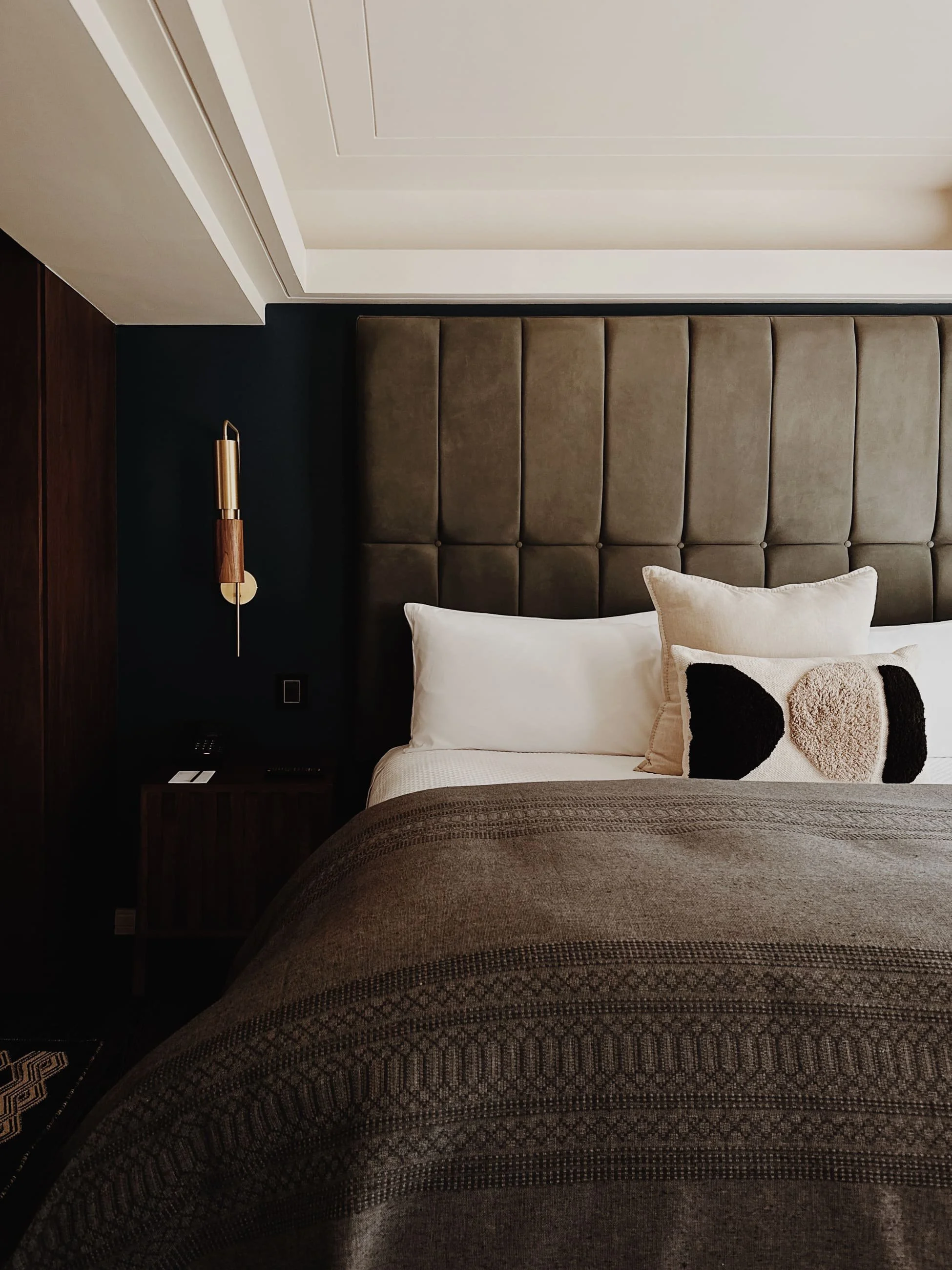 Hotel room with upholstered bed