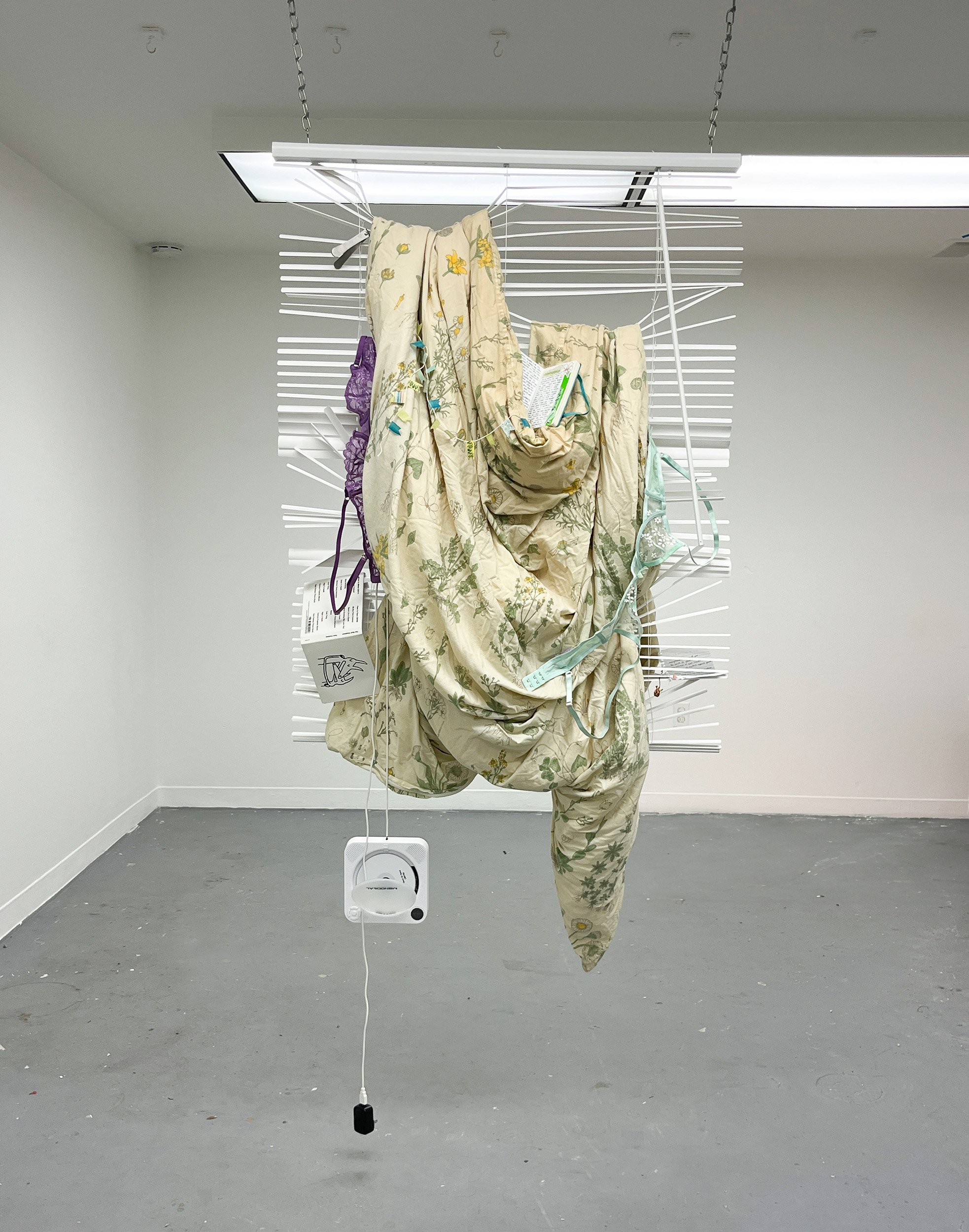 05.	Landscape of Love; Blinds, used comforter, CD player, nail clippers, journal, love letter, Twin Fantasy CD, dried flowers; 48” x 38”, 2023