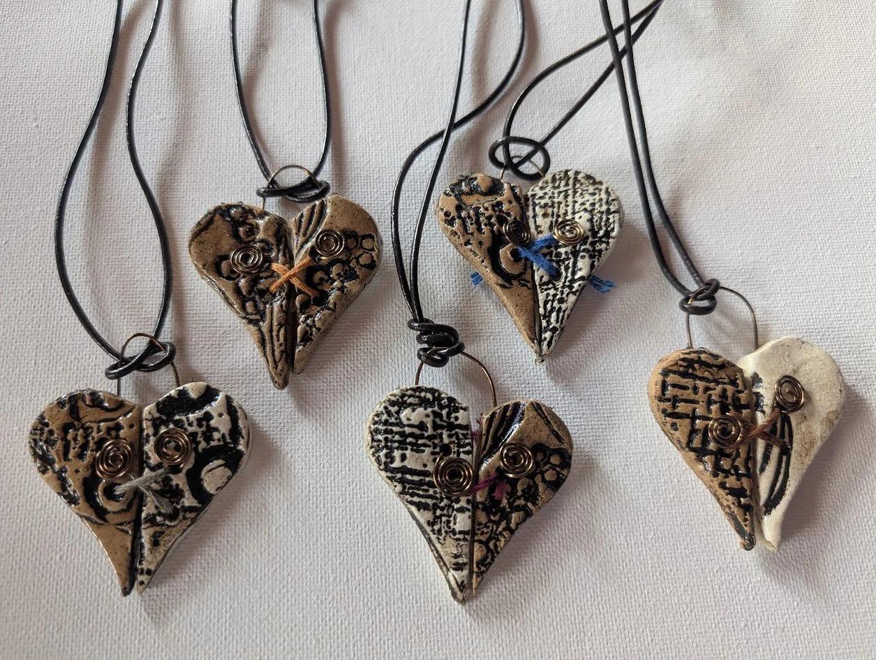 Mended Hearts (ceramic, leather and thread)