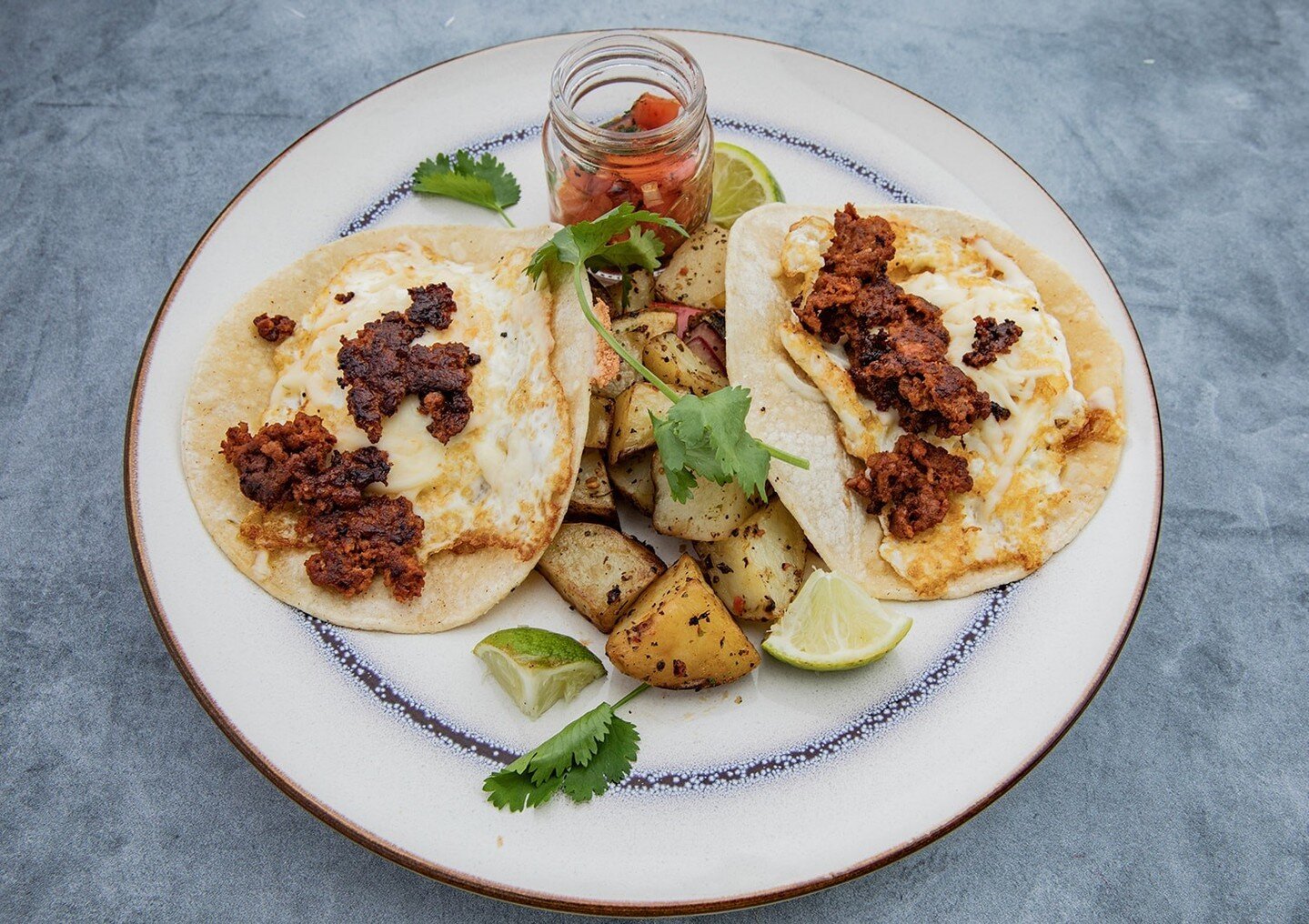 Breakfast tacos FTW 🙌🏼 
Two grilled flour tortillas filled with scrambled eggs, grilled chorizo, pepper jack cheese, and pico de Gallo. 
The perfect way to welcome the weekend in!
Happy Friday everyone 🌮