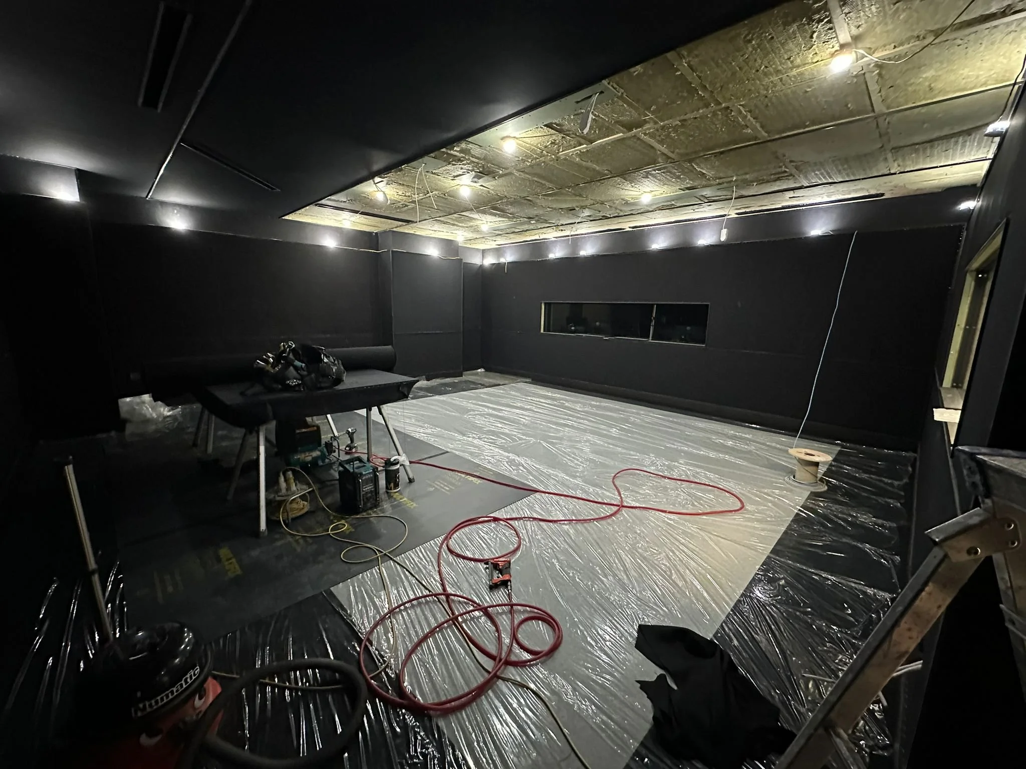 TV studio fit-out nearing completion at Global, Four Millbank, with Camira Lucia Havana fabric wall and ceiling finish.