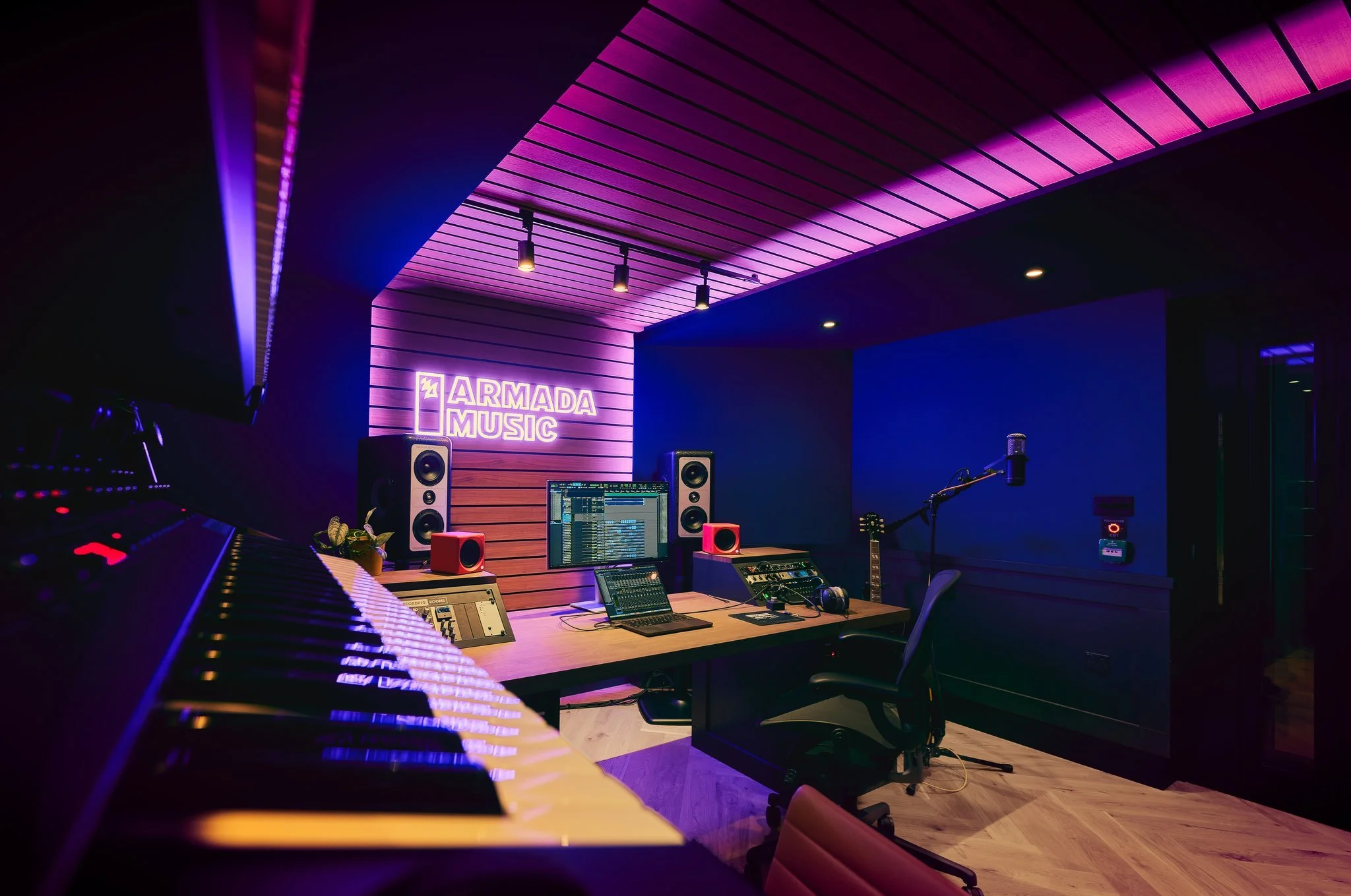 Studio 1 at Armada Music, London, view from the rear showing synth rack, workstation, Barefoot MicroMain27's and a Josephson C705 microphone on a stand.