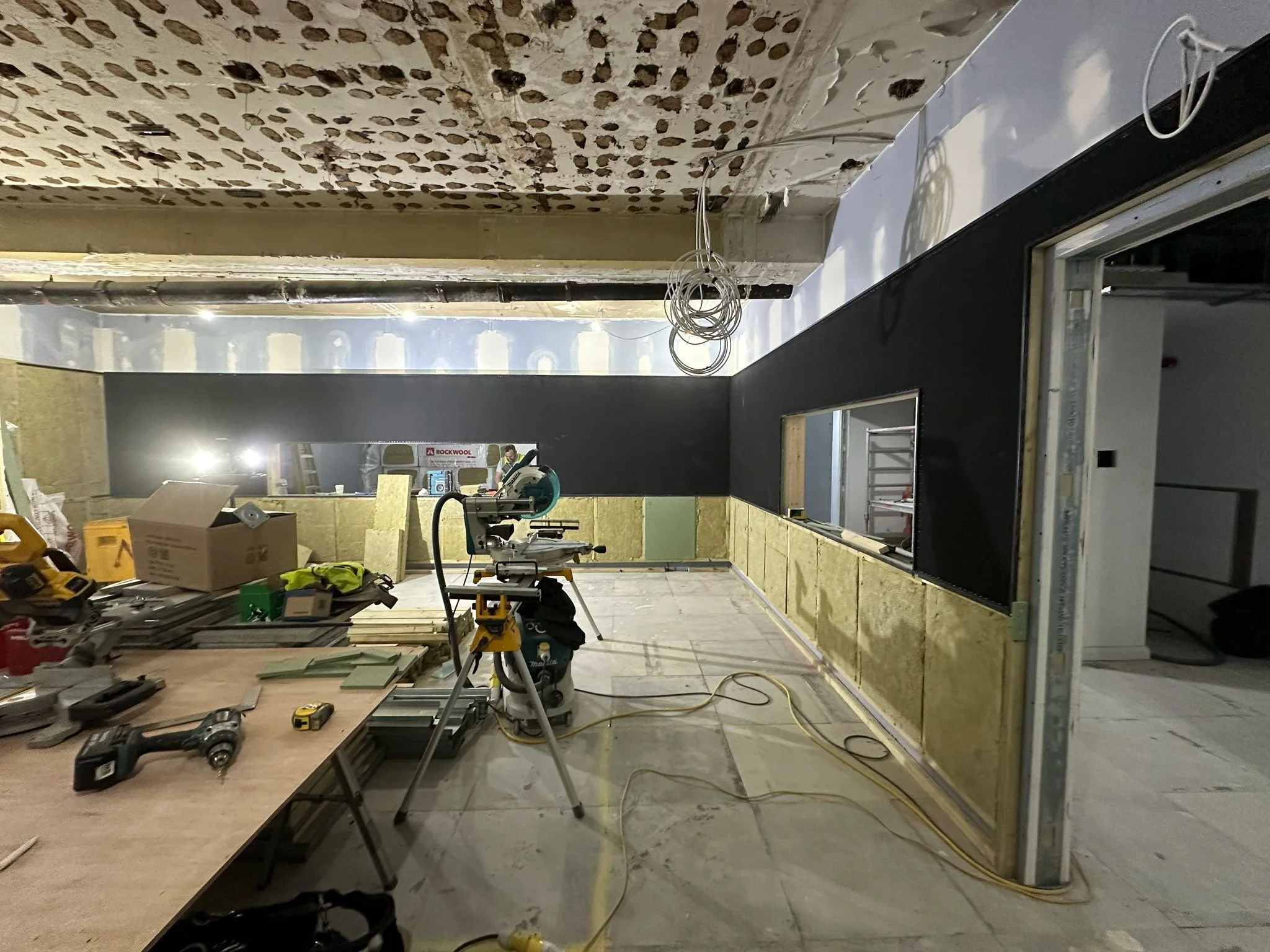 TV studio under construction at Global, Four Millbank, Westminster, showing acoustic treatments and stretched fabric walls.