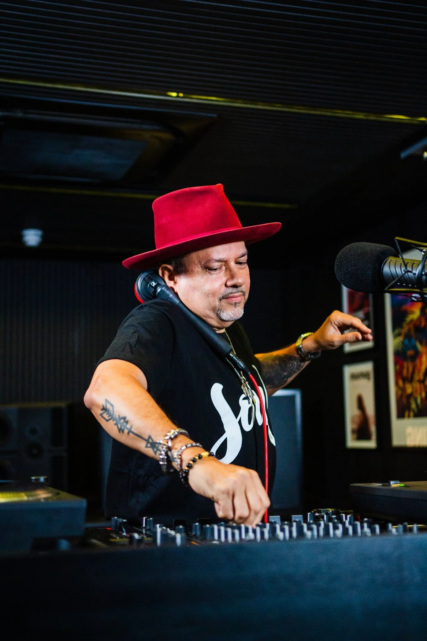 Close view of Louie Vega (Masters at Work) performing at the basement DJ booth at Defected HQ, London.