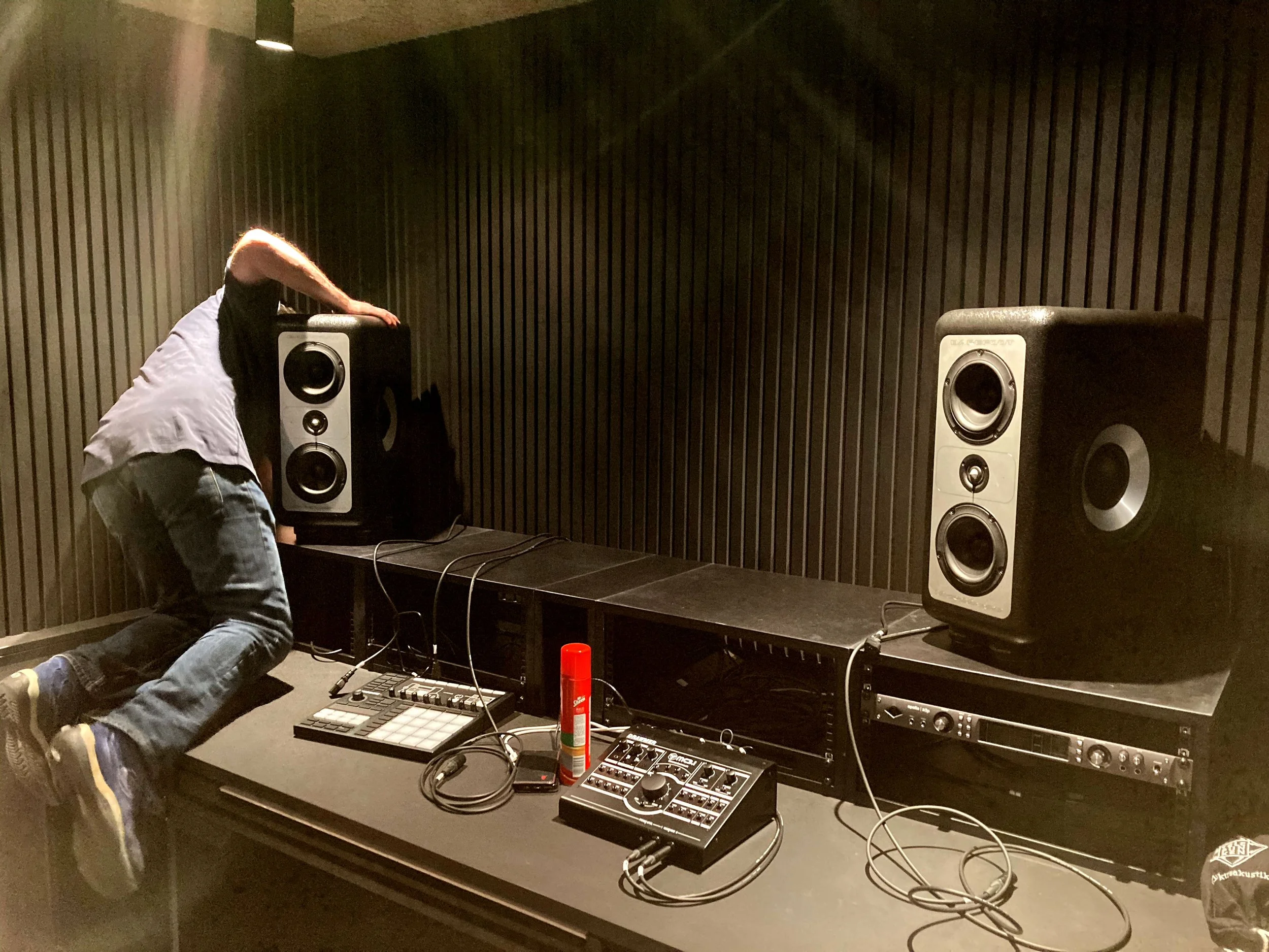 Engineer installing Barefoot MicroMain 27 monitors in the control room at Defected HQ, Shoreditch, London.