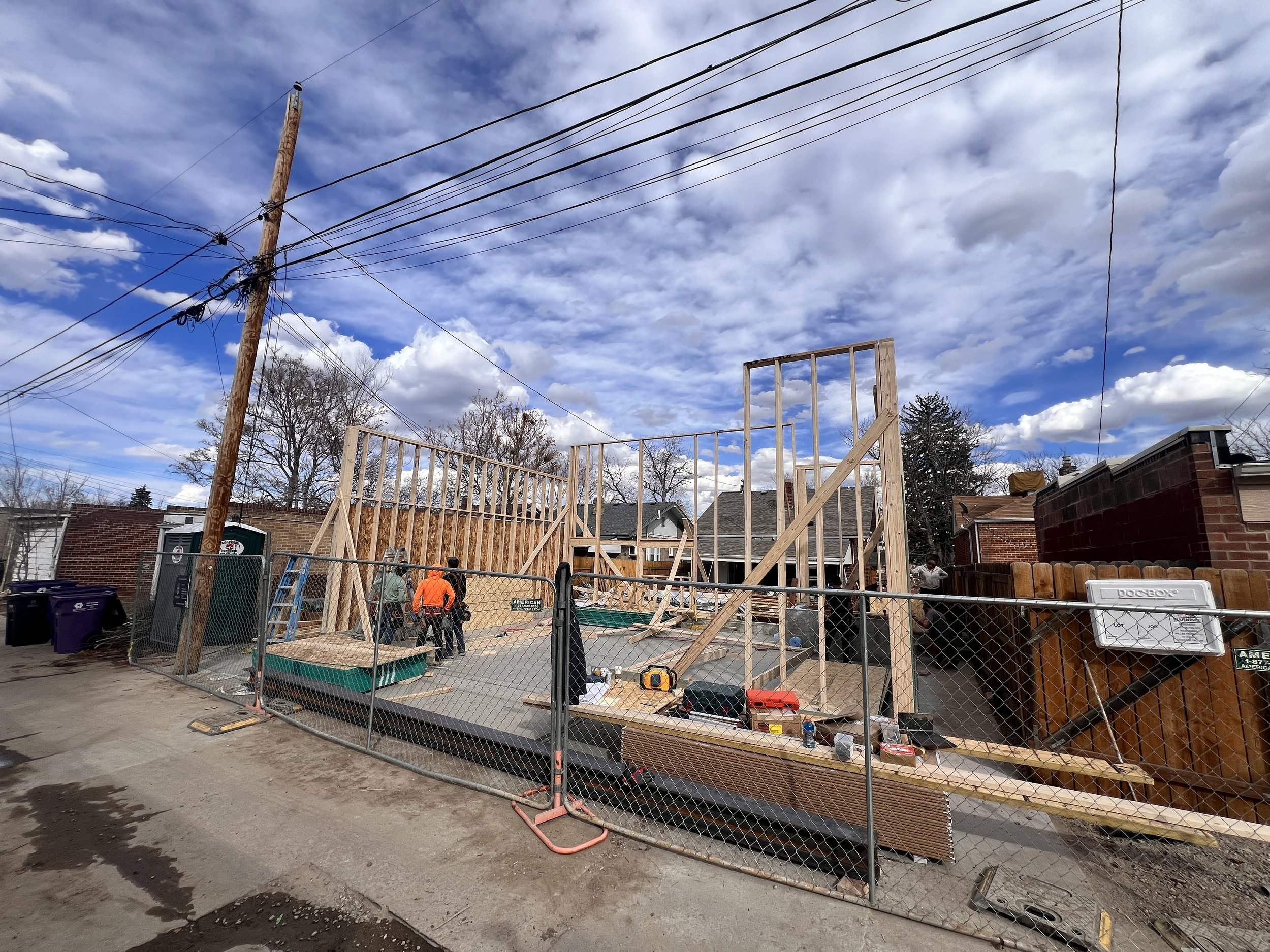 Framing in progress on a custom garage ADU in Denver’s Sunnyside neighborhood, showing structural walls, second-story layout, and design-build coordination by Prenvalley Builders.