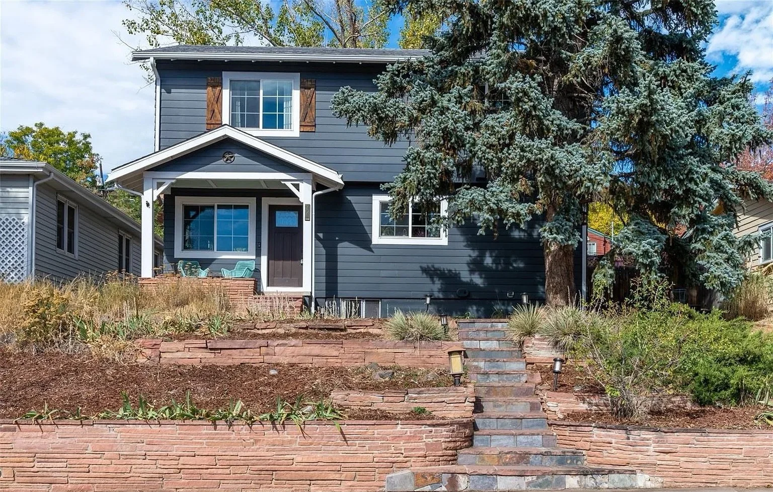 Front exterior of a completed second-story addition and whole-home renovation in Golden, Colorado, featuring new upper-level living space, updated siding, and improved street presence by Prenvalley Builders.