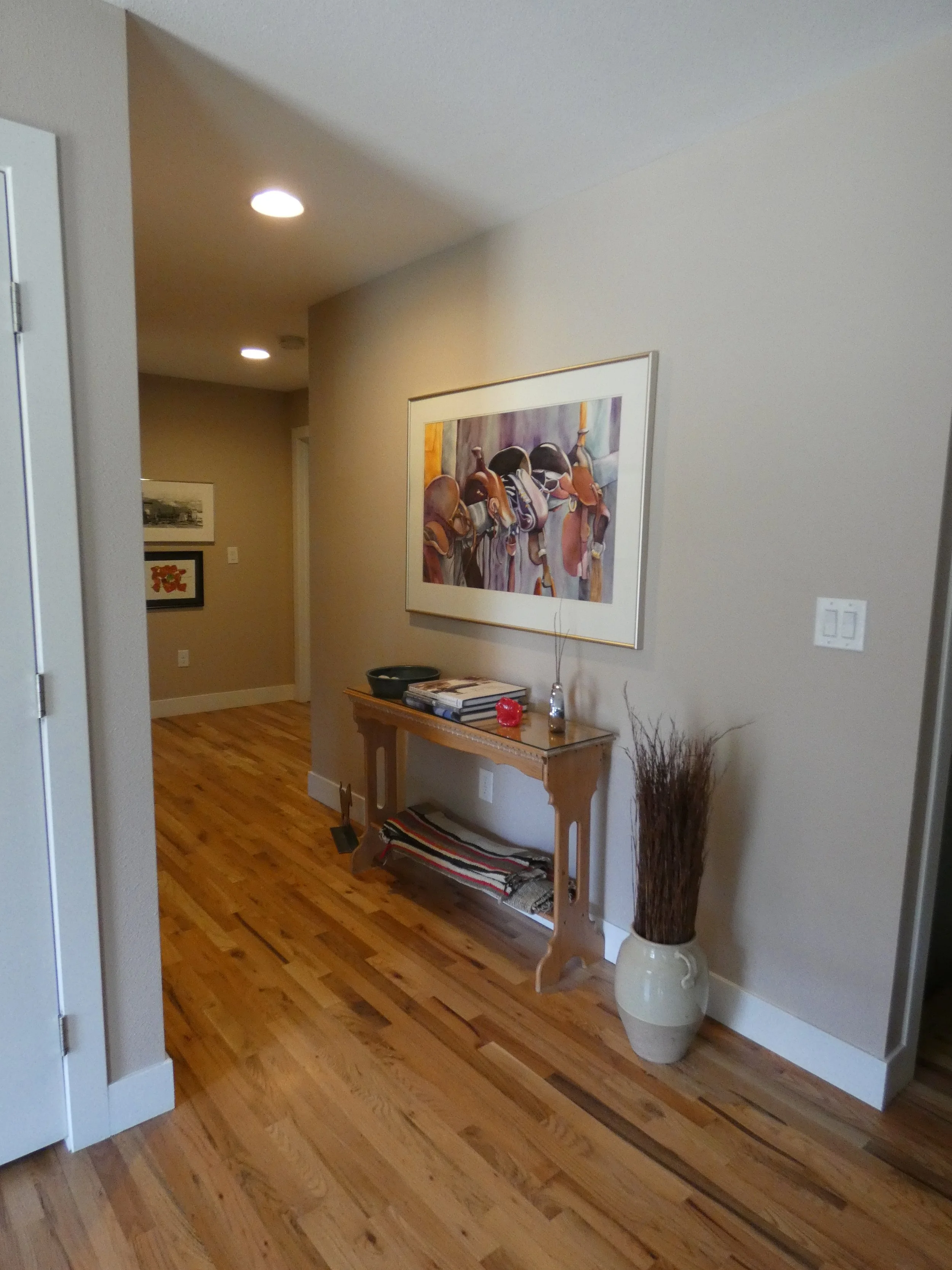 Finished bathroom vanity in a Denver home renovation, featuring custom cabinetry, stone countertop, updated lighting, and a clean, functional layout built by Prenvalley Builders.