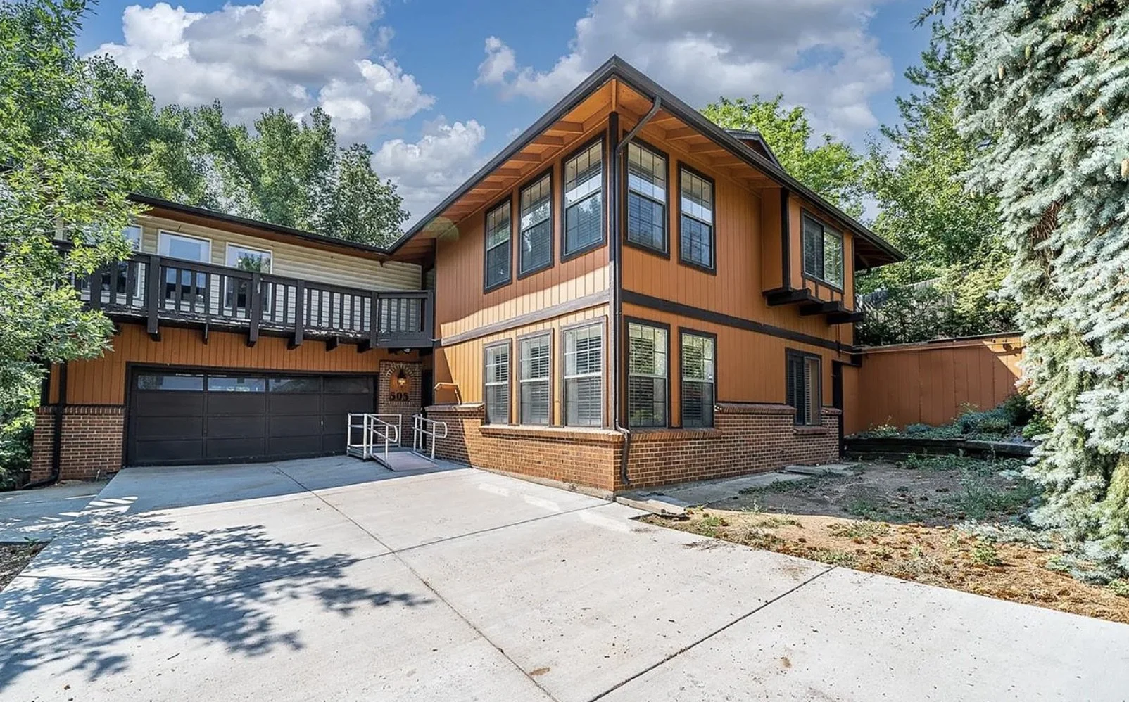 Before photo of an existing two-story home exterior prior to a full interior renovation in Golden, Colorado, completed by Prenvalley Builders.