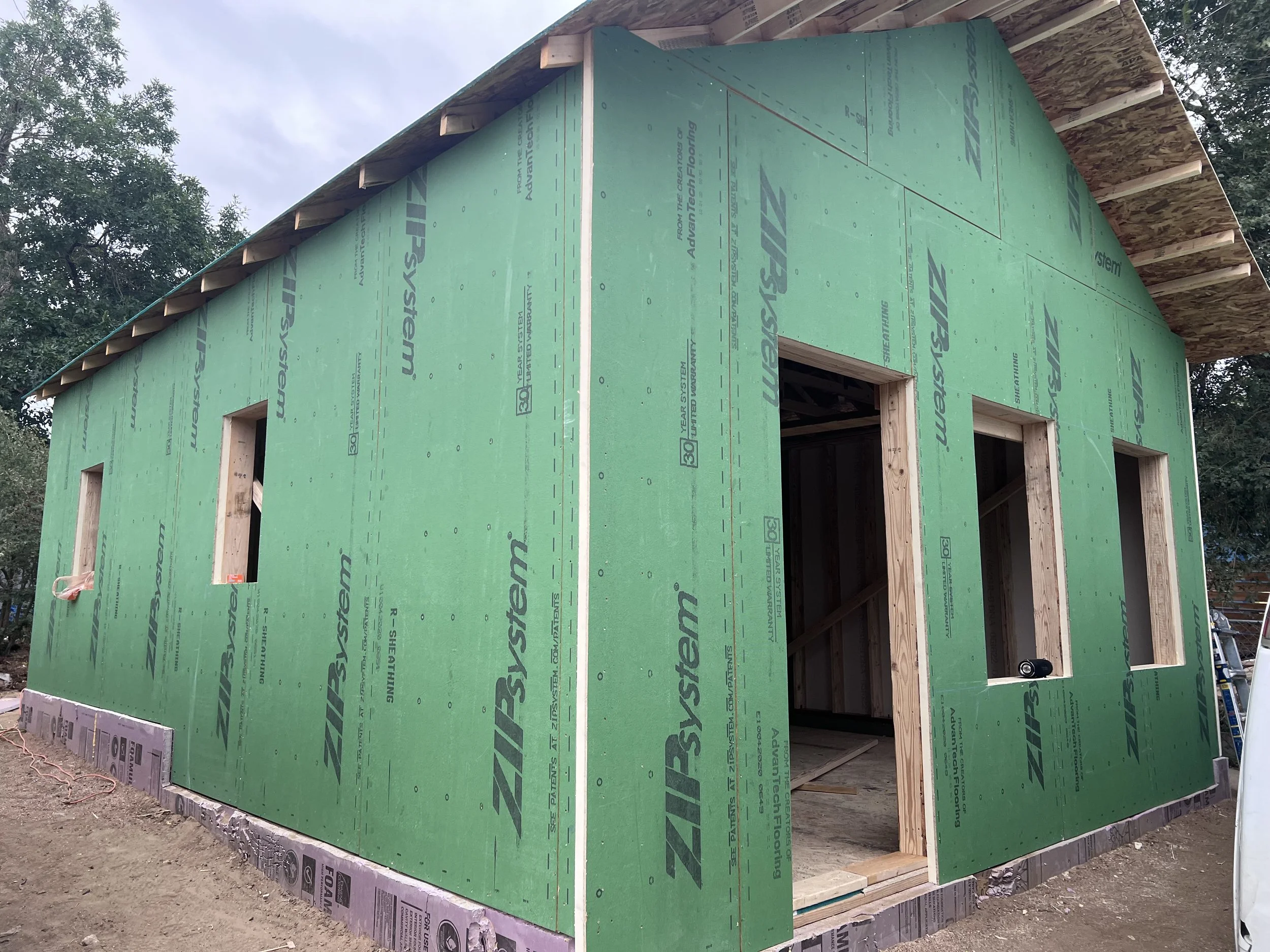 Exterior sheathing and building envelope installation on a detached accessory dwelling unit in Denver, showcasing mid-construction ADU work by Prenvalley Builders.