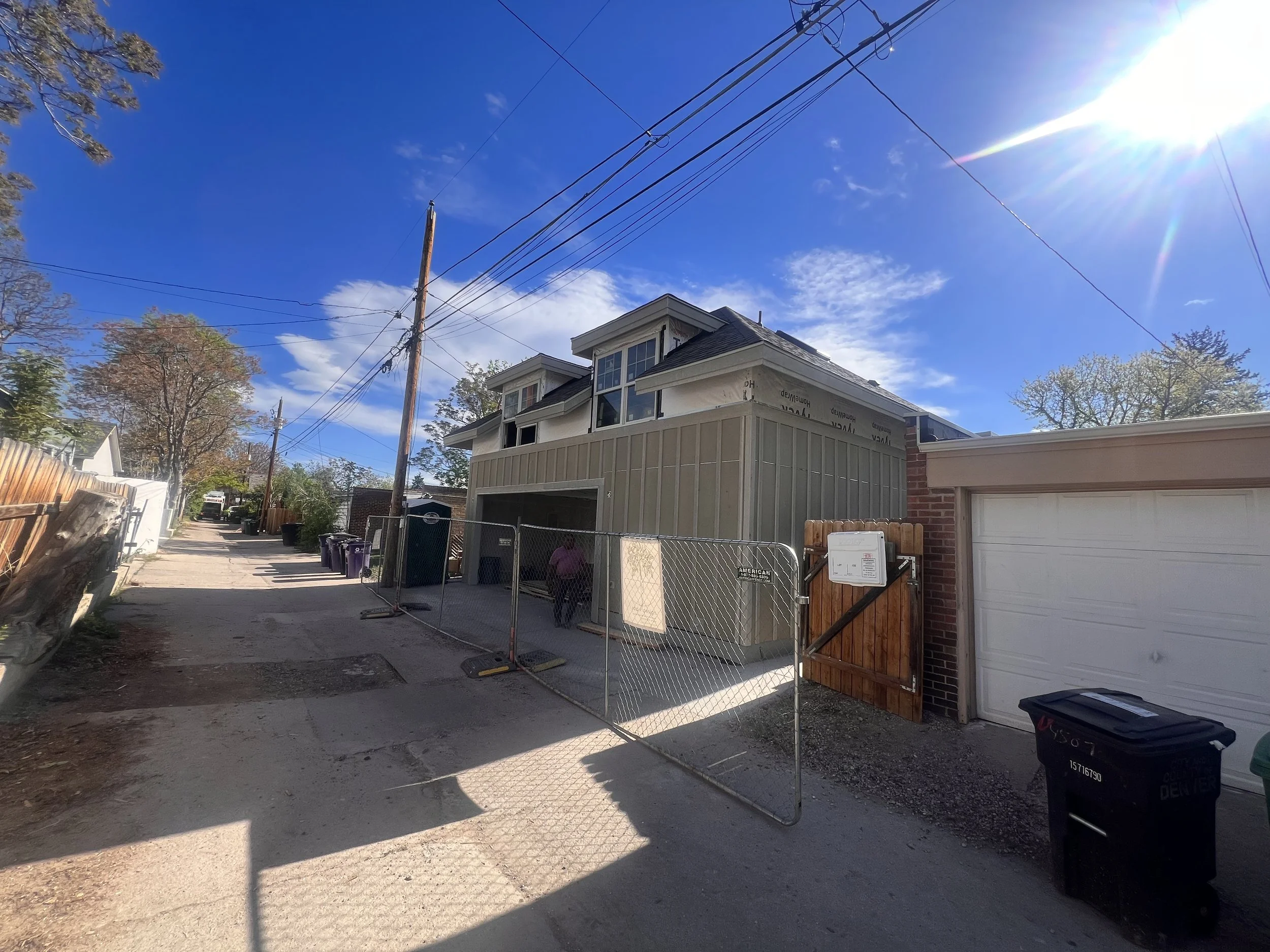 Exterior siding installation on a custom garage ADU in Denver’s Sunnyside neighborhood, showing vertical siding, dormer windows, and architectural detailing built by Prenvalley Builders.