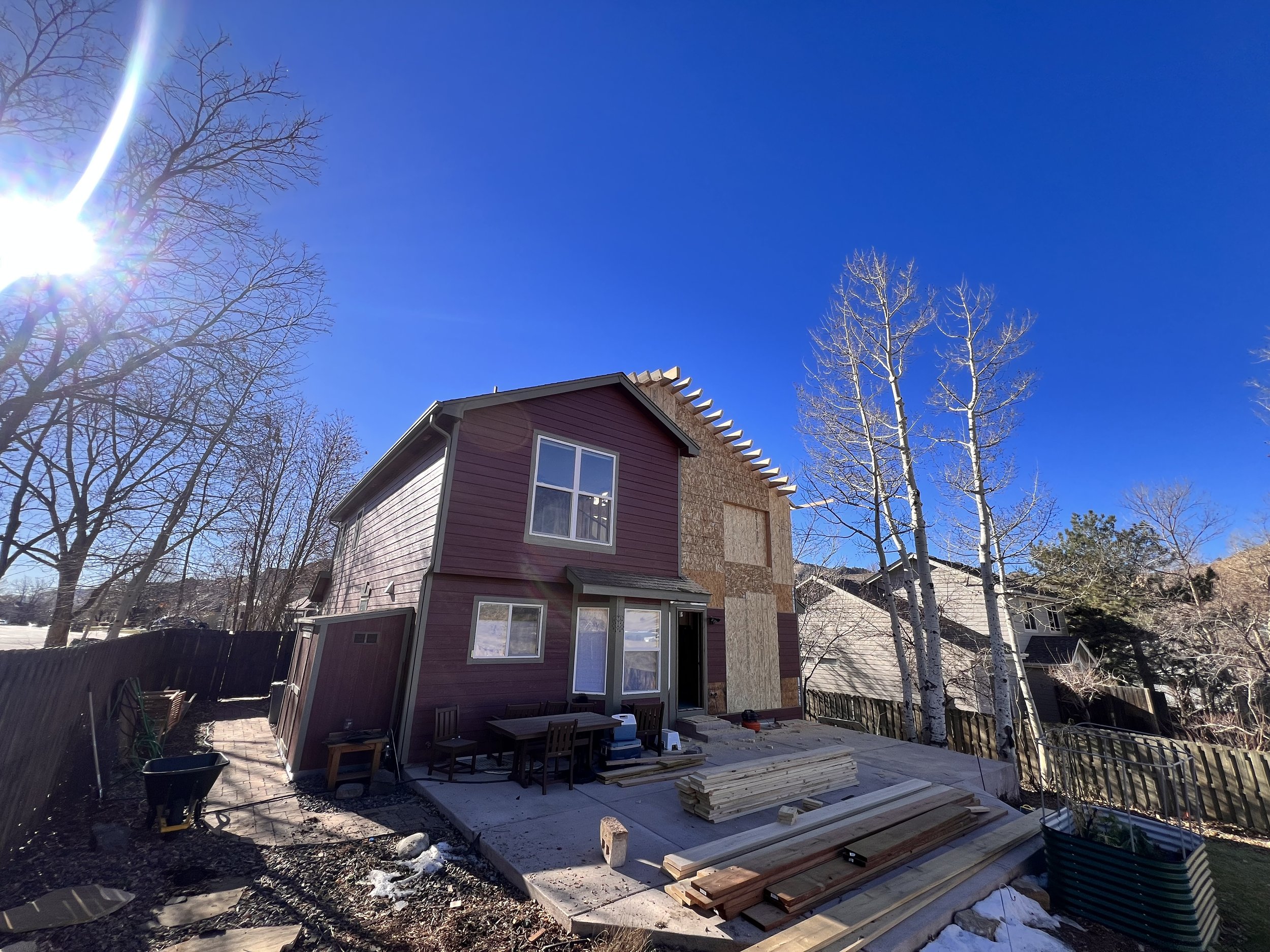 Partial second-story pop-top renovation in Golden, Colorado, showing a newly added upper-level structure integrated into the existing home near North Table Mountain.