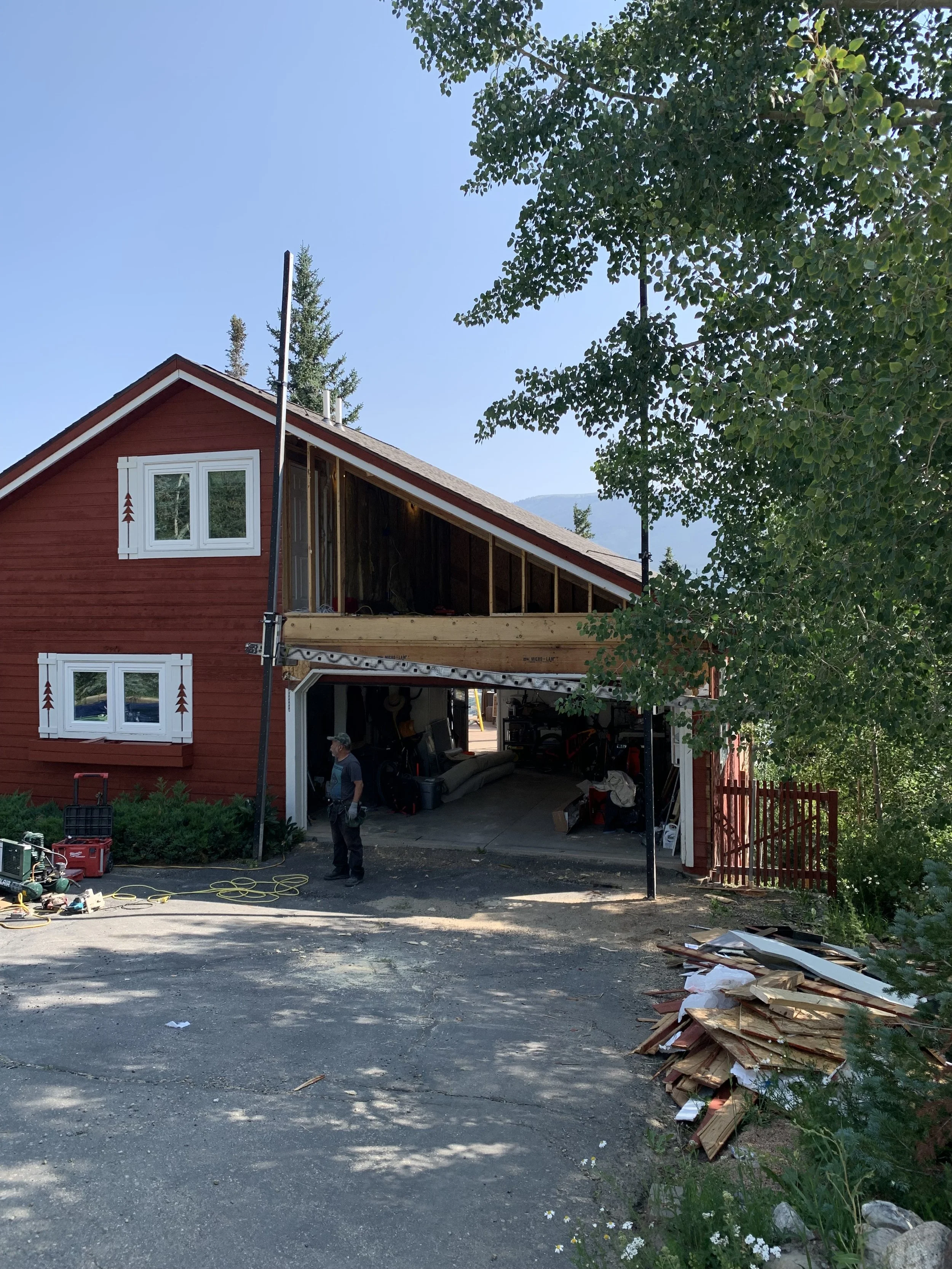 Second-story pop-top renovation under construction in Silverthorne, Colorado, showing the beginning stages to adding a new upper-level addition above an existing garage as part of a mountain home renovation by Prenvalley Builders.