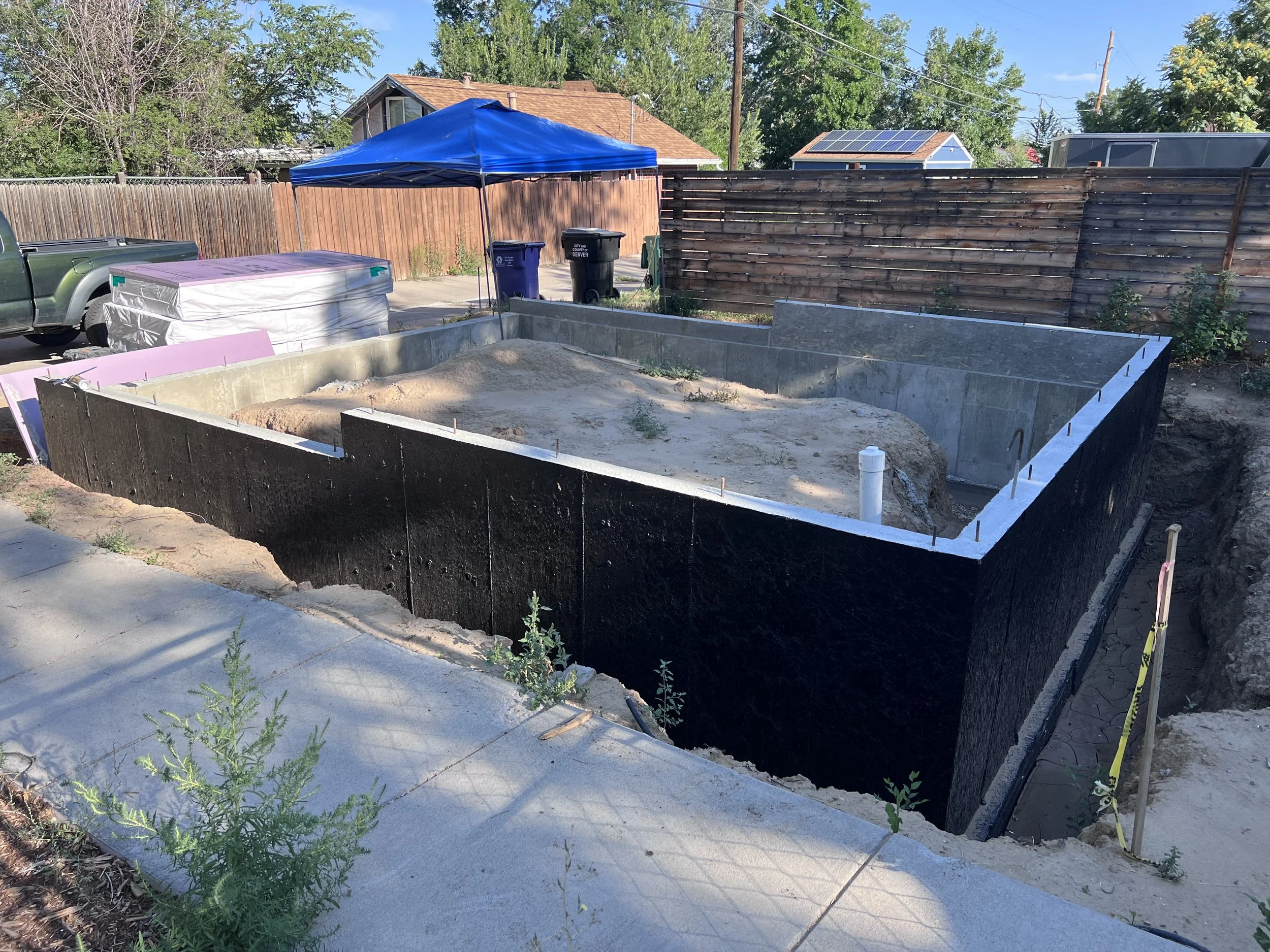 Concrete foundation and slab preparation for a detached accessory dwelling unit in a Denver neighborhood, showing early-stage ADU construction by Prenvalley Builders.