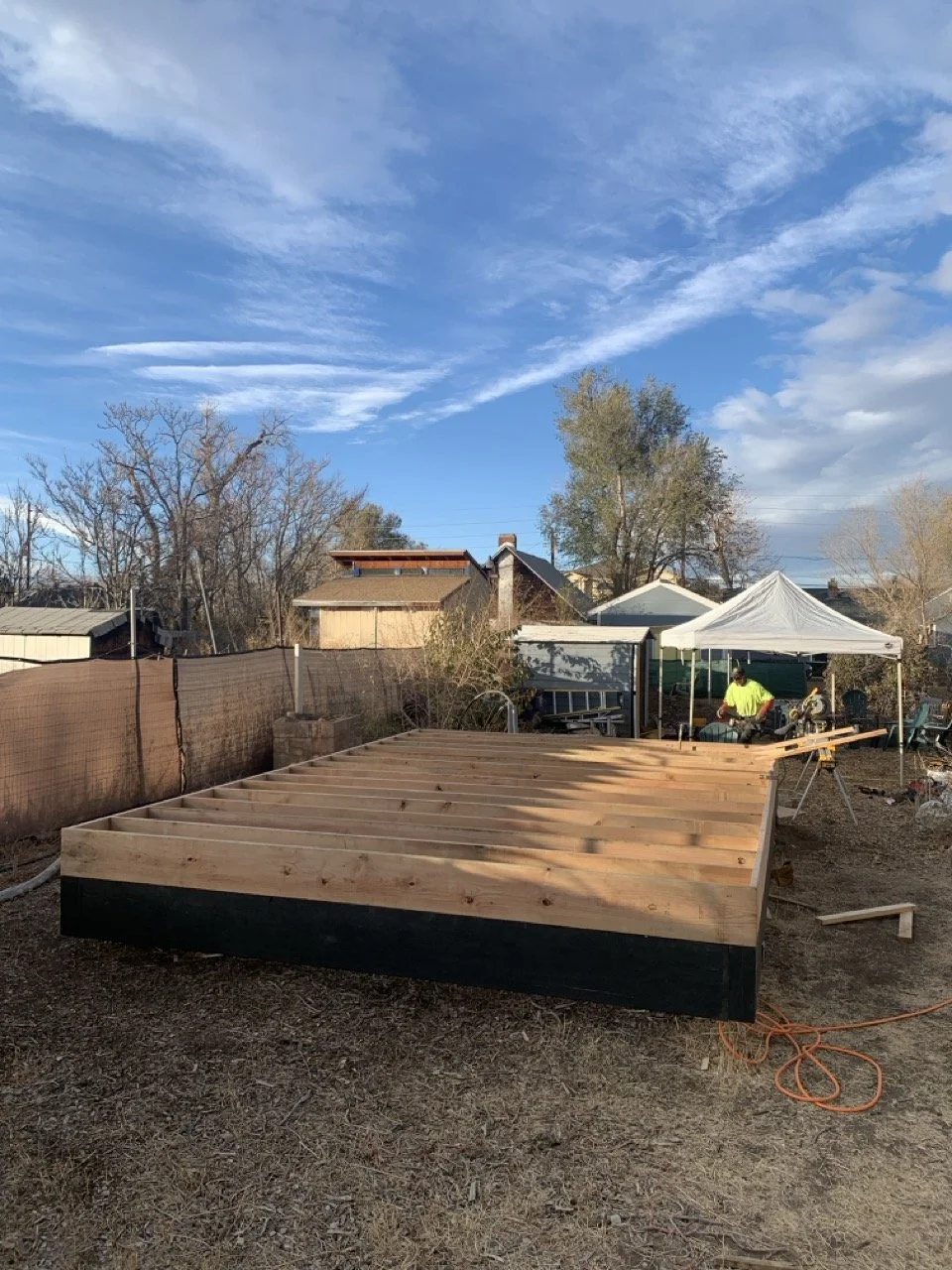 Floor framing and platform construction for a detached accessory dwelling unit in Denver, Colorado, built by Prenvalley Builders, showing dimensional lumber framing prepared for vertical construction.