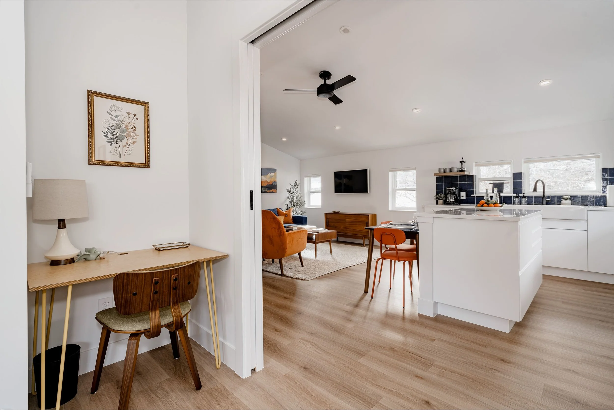 Small home office nook inside a two-story design-build ADU in Denver, positioned near the kitchen and living area to support flexible work and daily living by Prenvalley Builders.