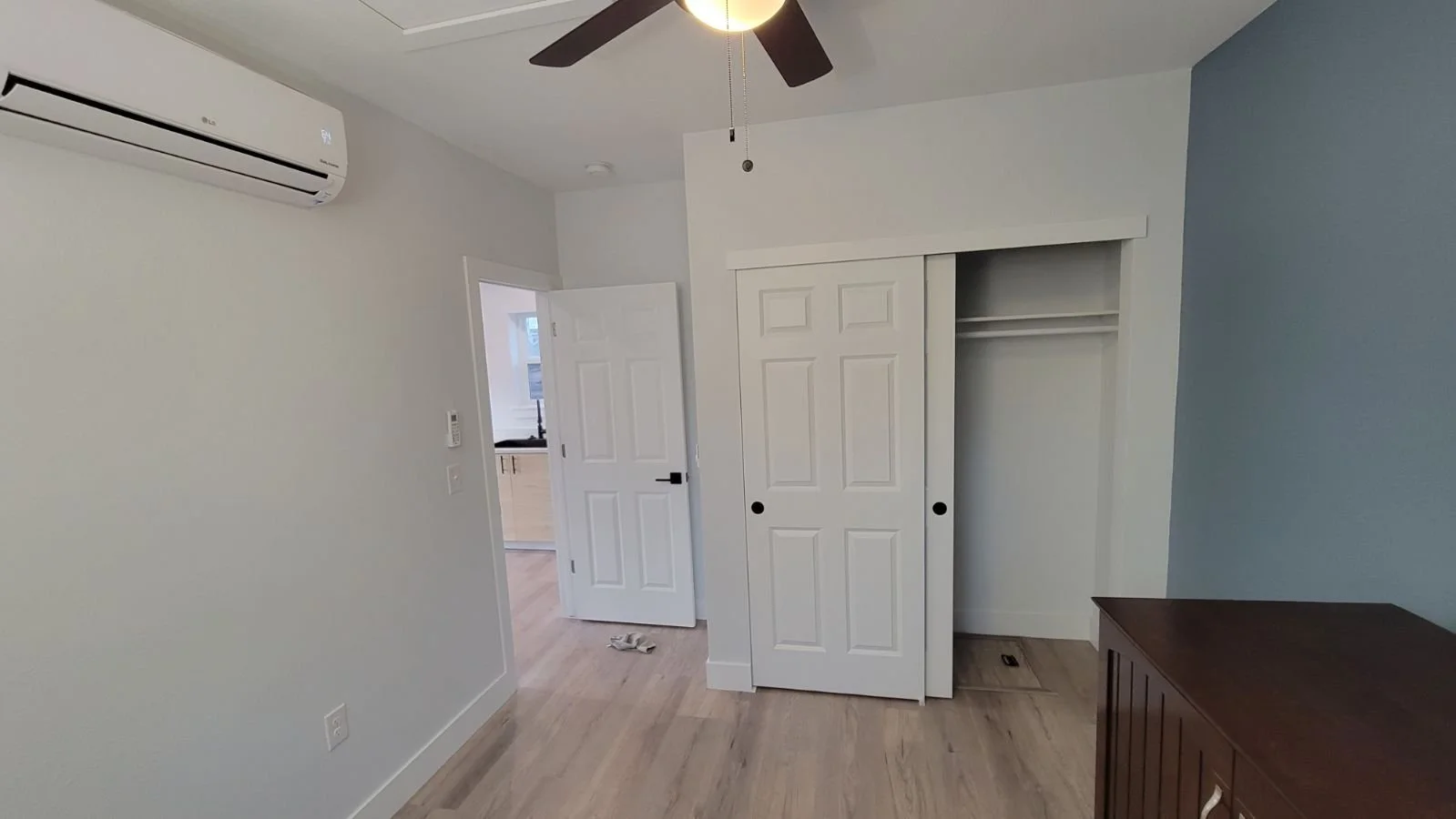 Finished bedroom interior inside a detached accessory dwelling unit in Denver, featuring built-in storage, efficient layout, and modern comfort by Prenvalley Builders.