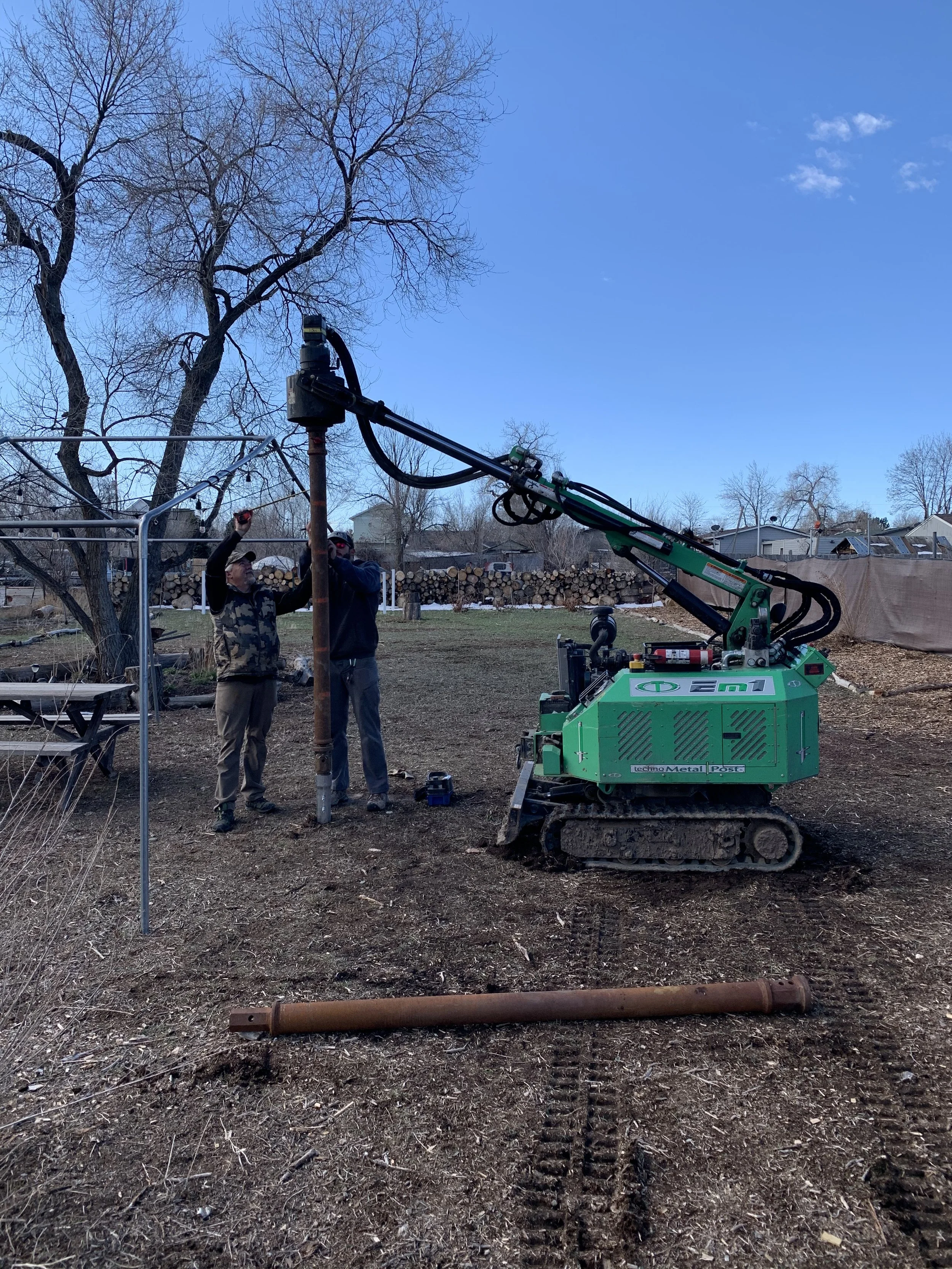 Installation of helical piers for a detached accessory dwelling unit in Denver, Colorado, with construction crews setting deep foundation supports as part of an ADU build by Prenvalley Builders.