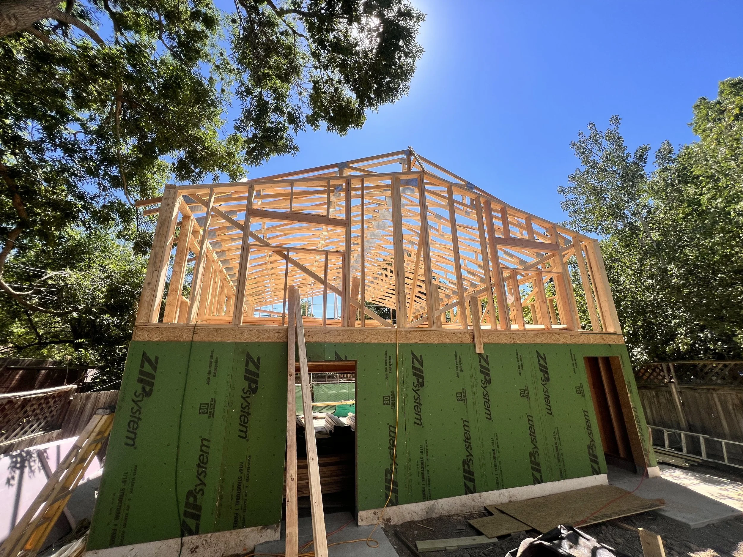 Upper-level wood framing for a two-story design-build ADU in Denver, constructed above a garage with advanced structural detailing by Prenvalley Builders.